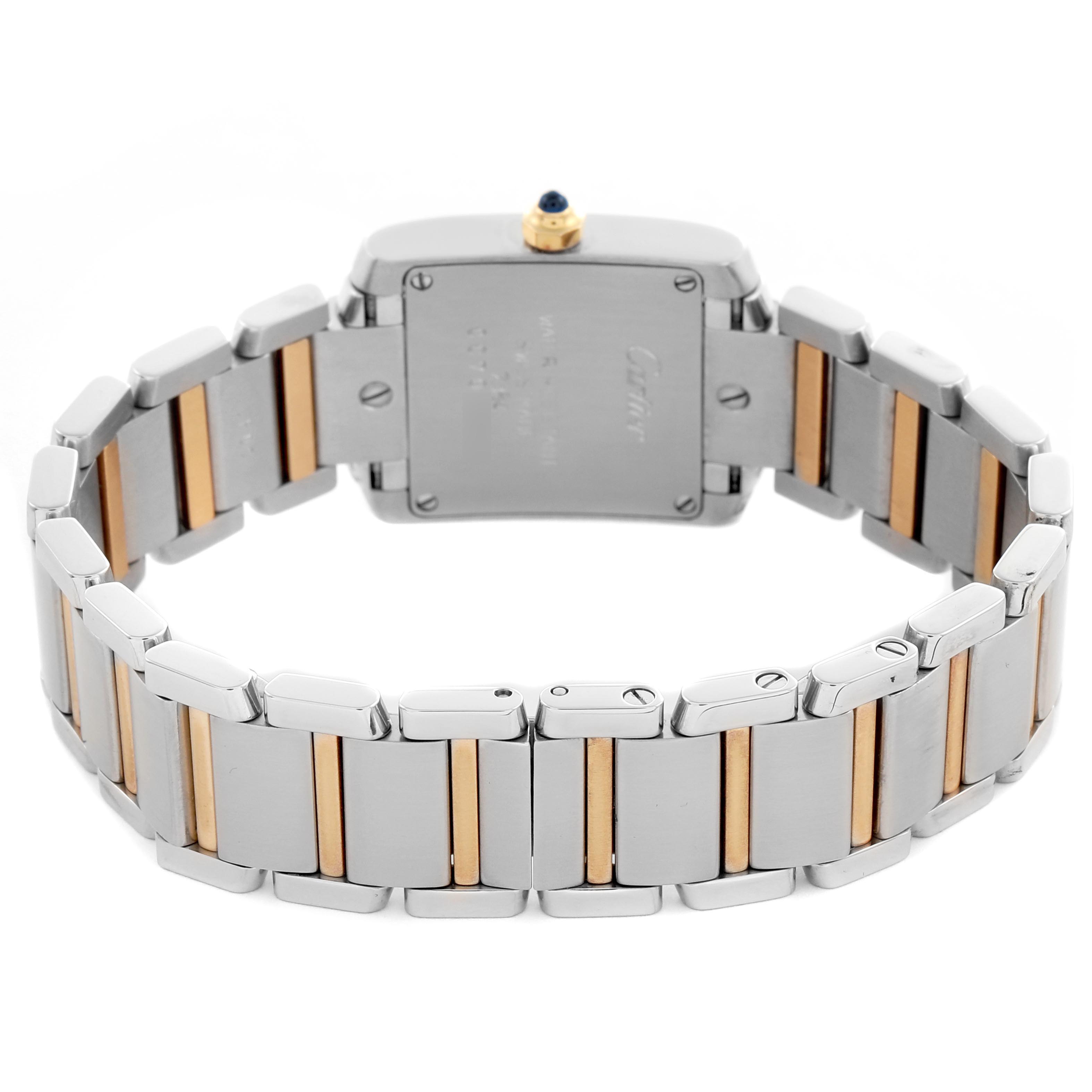 The image shows the back and bracelet of a Cartier Tank Française, highlighting its two-tone metal links and case back.