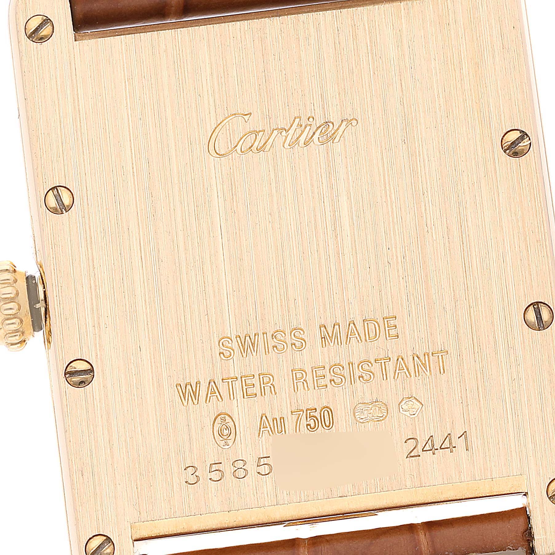 Close-up of the back case of the Cartier Tank Louis W1529756 Men
s Yellow Gold Silver Dial W1529756 Men
s Yellow Gold Silver Dial watch, displaying the brand engraving and specifications.