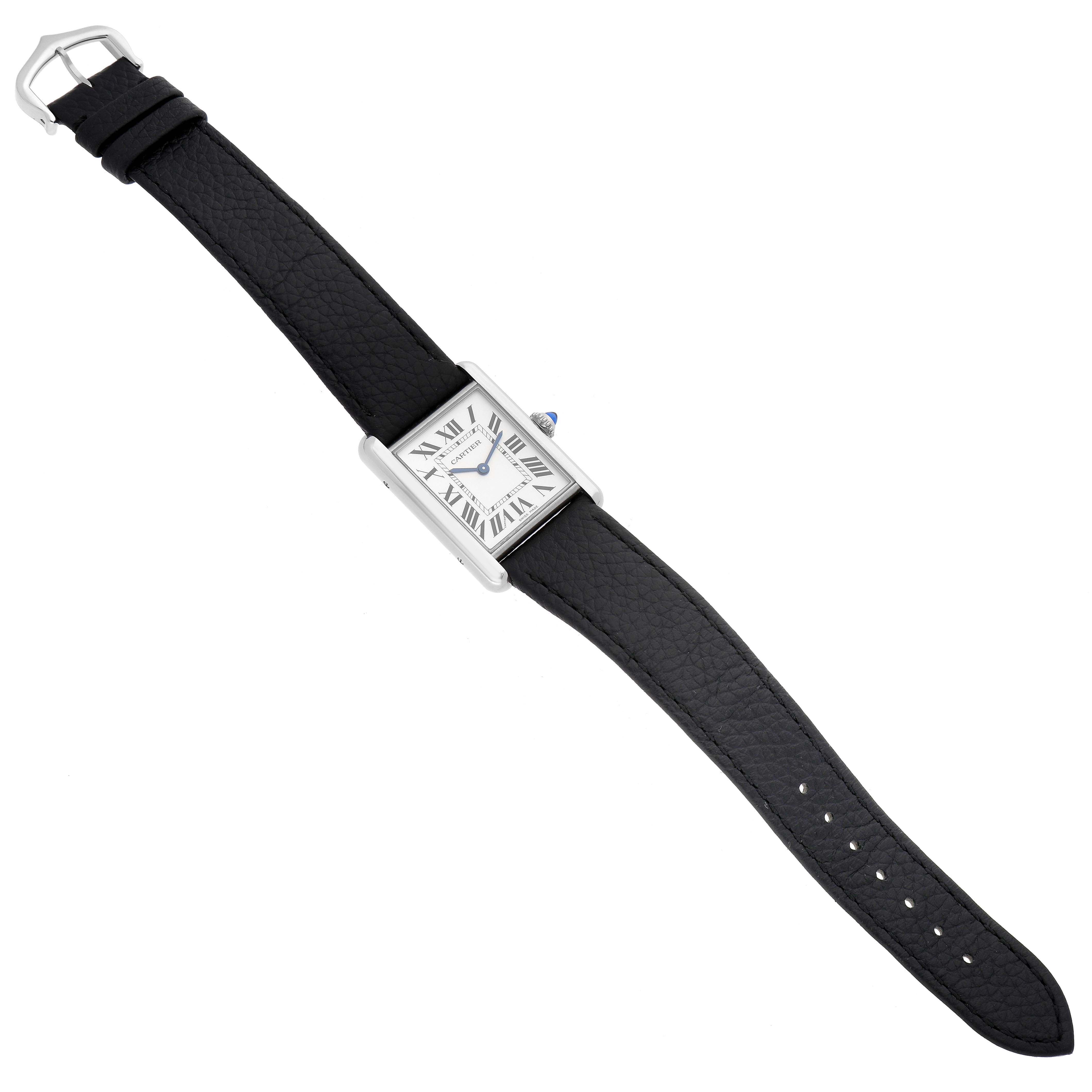 The image shows a Cartier Tank Must WSTA0041 Women's Stainless Steel Silver Dial WSTA0041 Women's Stainless Steel Silver Dial watch laid flat, showcasing the rectangular face, Roman numerals, and black leather strap.