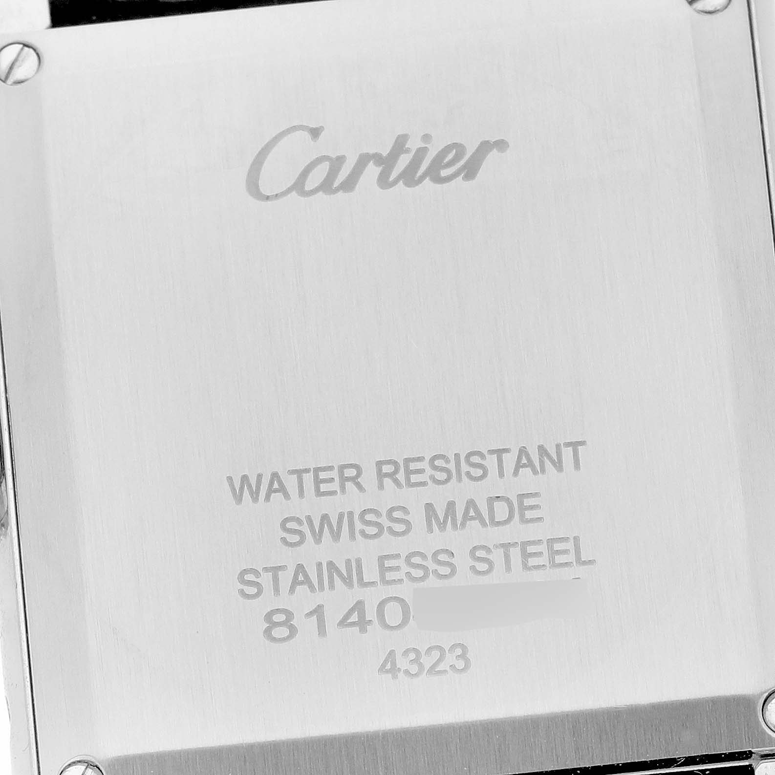 The image shows the back case of a Tank Must model by Cartier, displaying branding and product details.