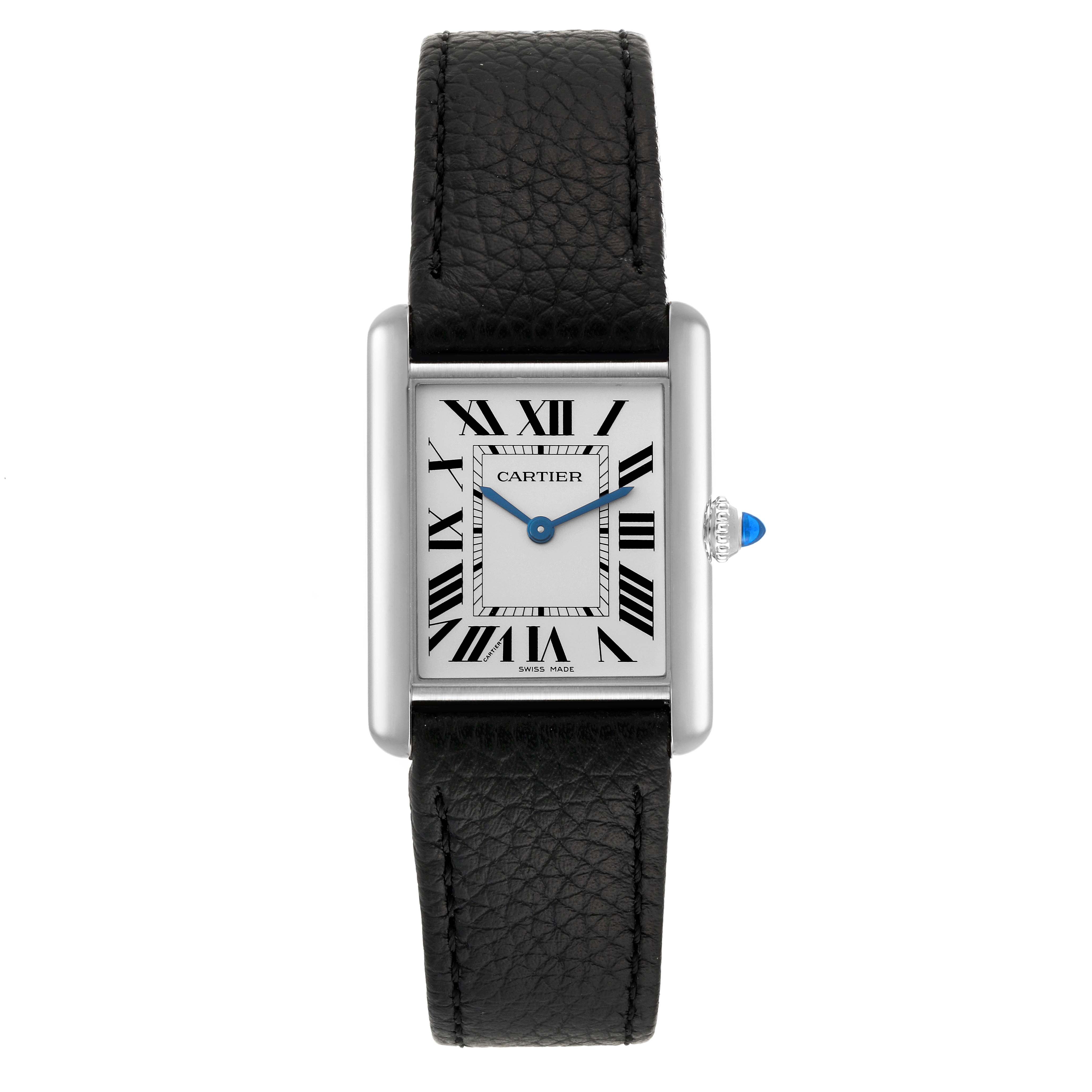 The image shows a Cartier Tank Must WSTA0041 Women's Stainless Steel Silver Dial WSTA0041 Women's Stainless Steel Silver Dial watch from a top-down angle, highlighting the face, strap, and crown with blue cabochon.