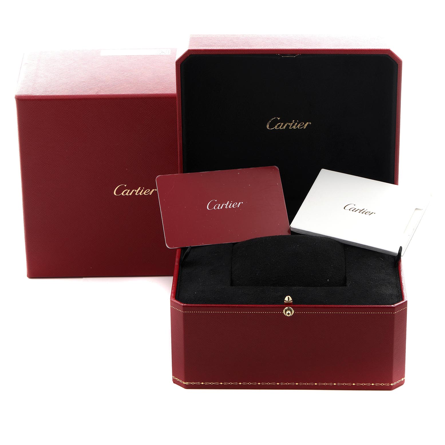 The image shows the packaging and accessories for a Cartier Tank Must WSTA0040 Men's Stainless Steel Silver Dial WSTA0040 Men's Stainless Steel Silver Dial watch, including a red box and card angled from above.