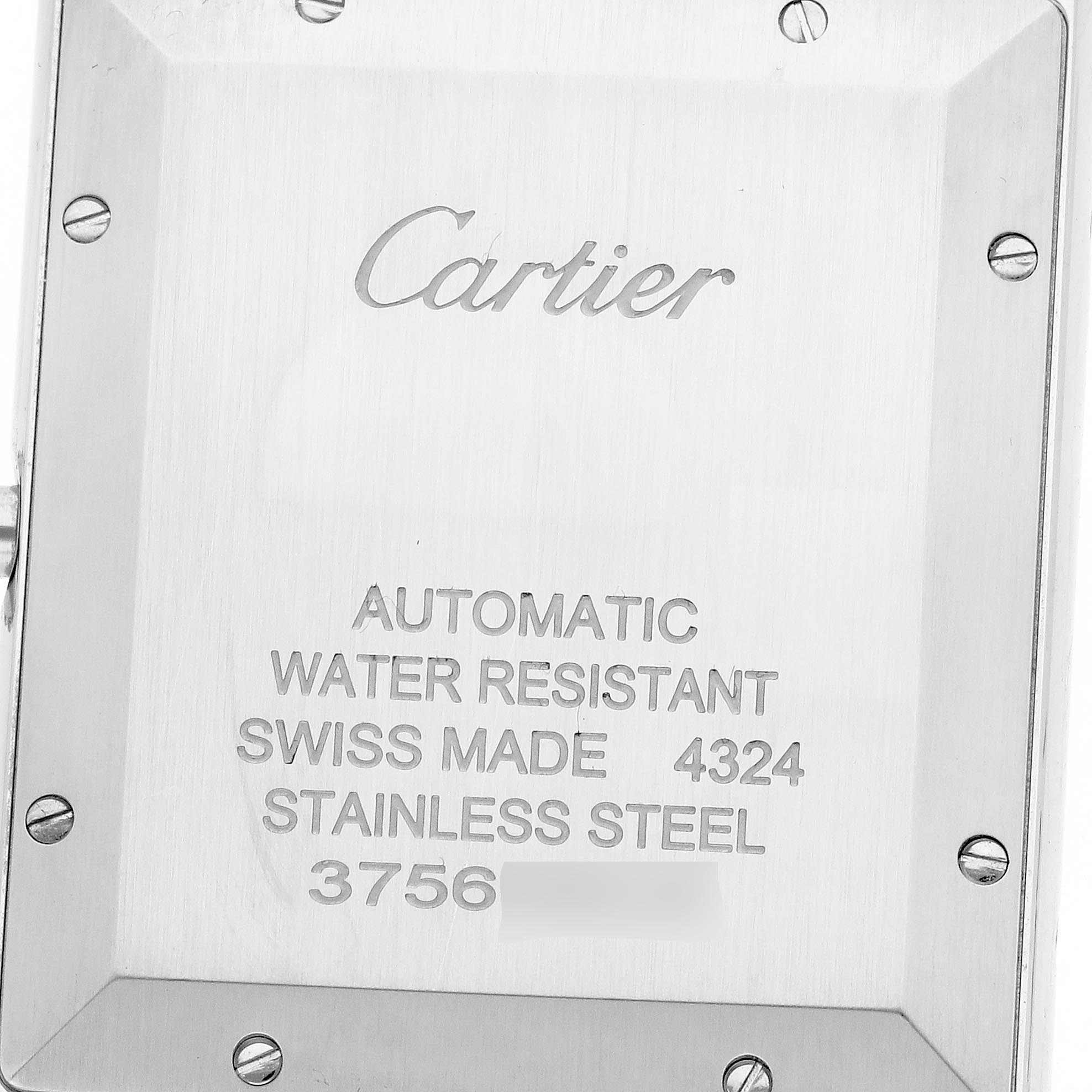 The image shows the back of a Cartier Tank Must WSTA0040 Men's Stainless Steel Silver Dial WSTA0040 Men's Stainless Steel Silver Dial watch, highlighting engraving details and screws.