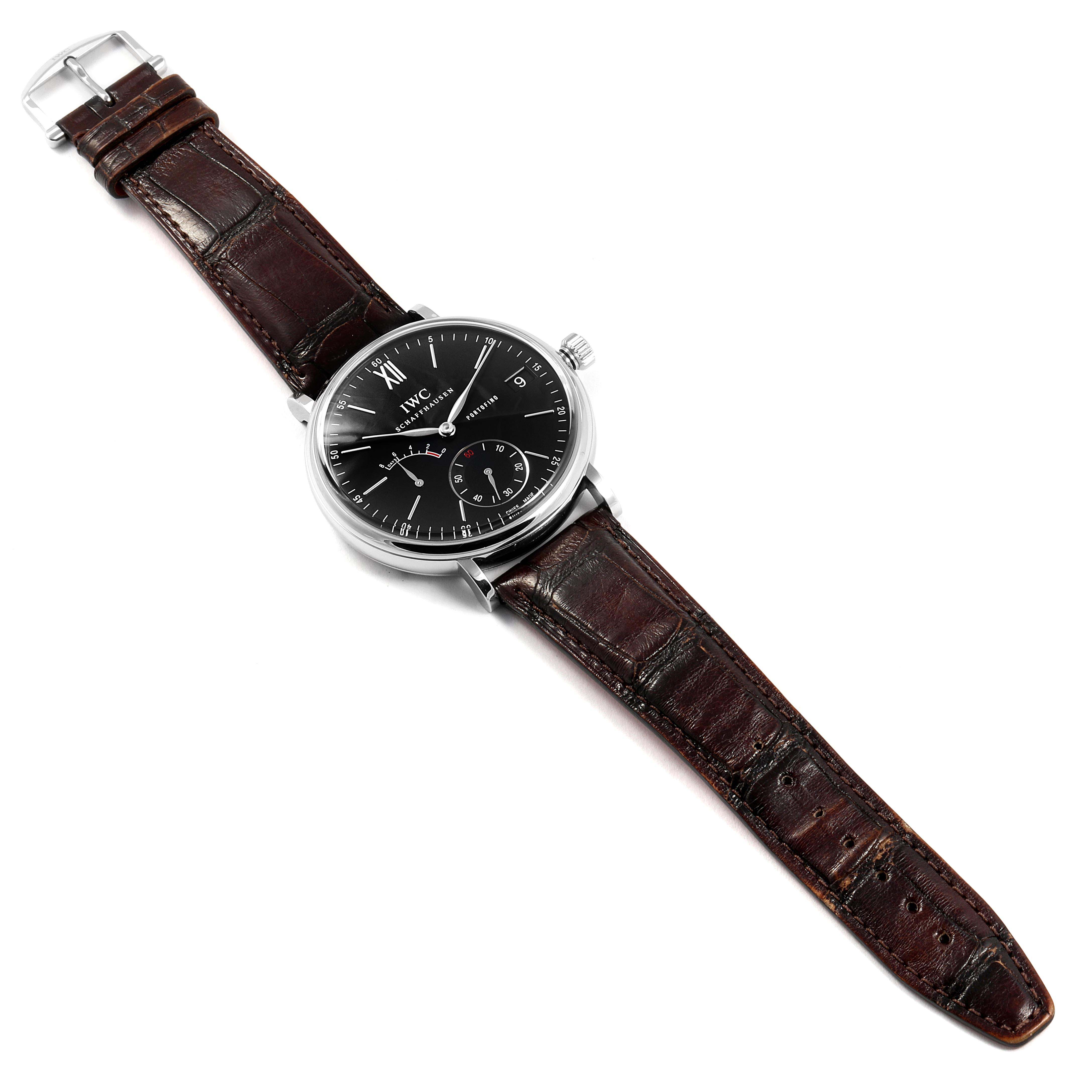 The image shows a full view of the IWC Portofino IW510102 Men's Stainless Steel Black Dial IW510102 Men's Stainless Steel Black Dial watch with a black dial and brown leather strap.