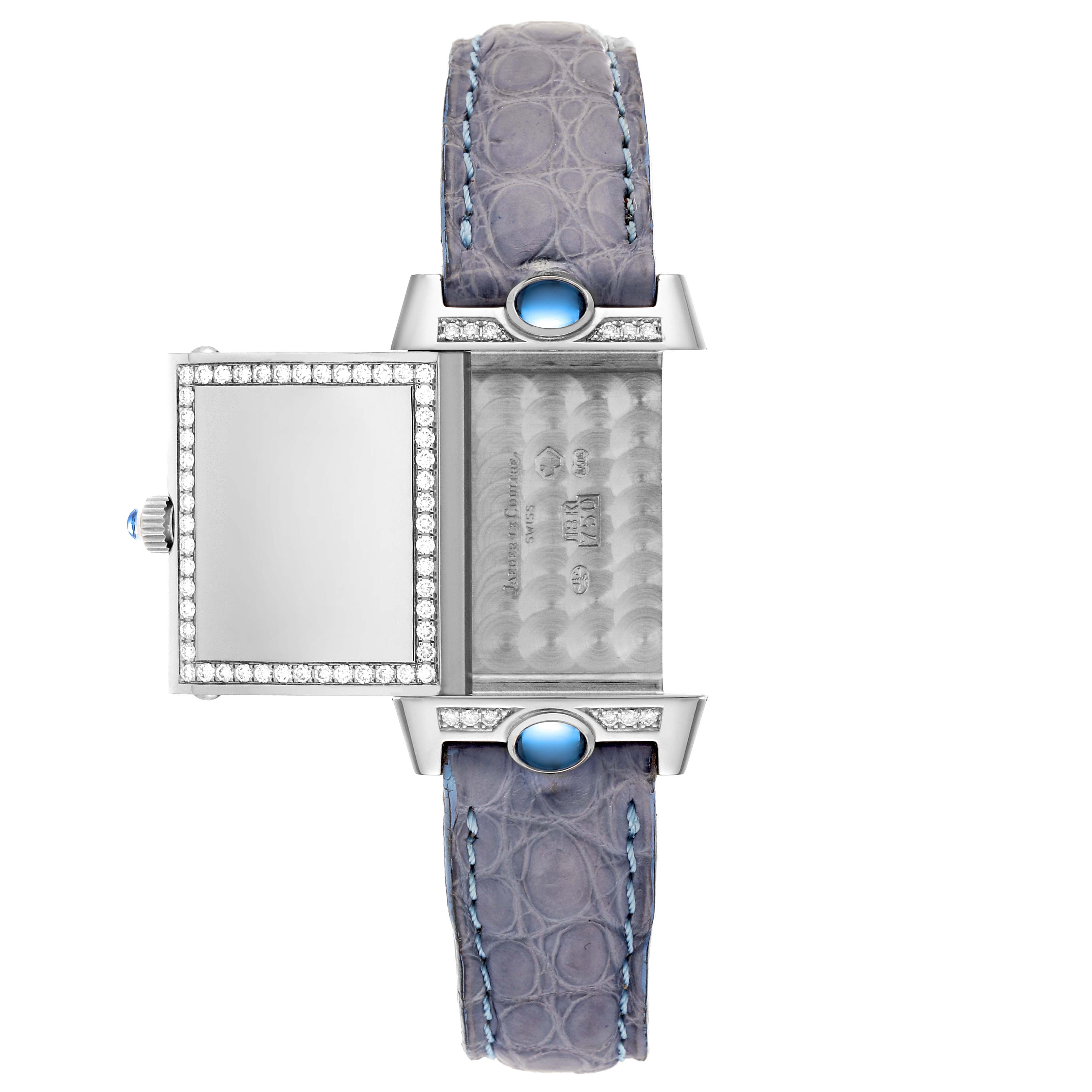This top-down view of the Reverso model by Jaeger LeCoultre shows the watch’s case, crown, and decorated straps.