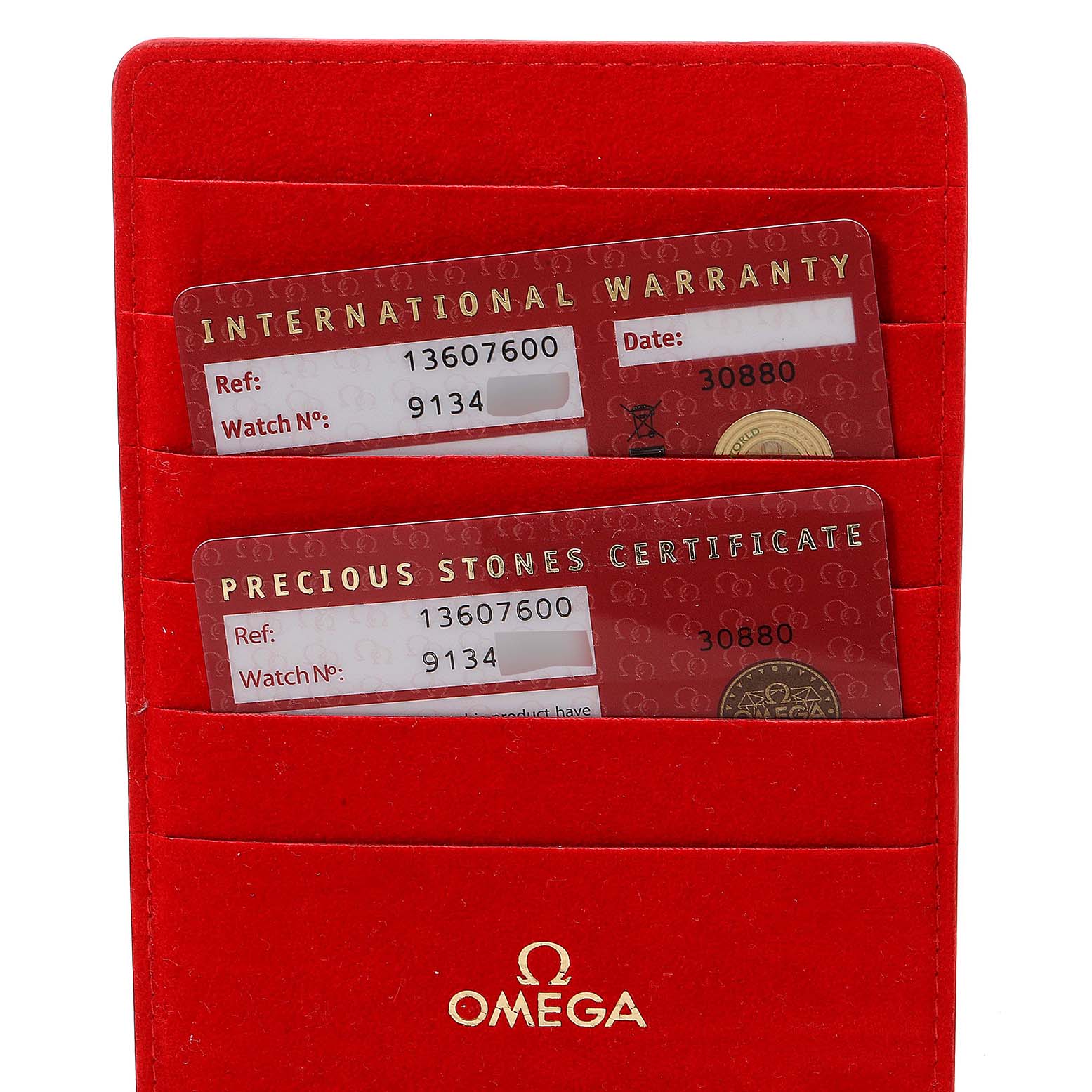 This image shows the warranty and certificate cards in a red Omega 1360.76.00 Women's Steel and Gold (two tone) Mother of Pearl Dial 1360.76.00 Women's Steel and Gold (two tone) Mother of Pearl Dial cardholder for the Omega 1360.76.00 Women's Steel and Gold (two tone) Mother of Pearl Dial 1360.76.00 Women's Steel and Gold (two tone) Mother of Pearl Dial Constellation Mini Steel Rose Gold Diamond Watch 1360.76.00.