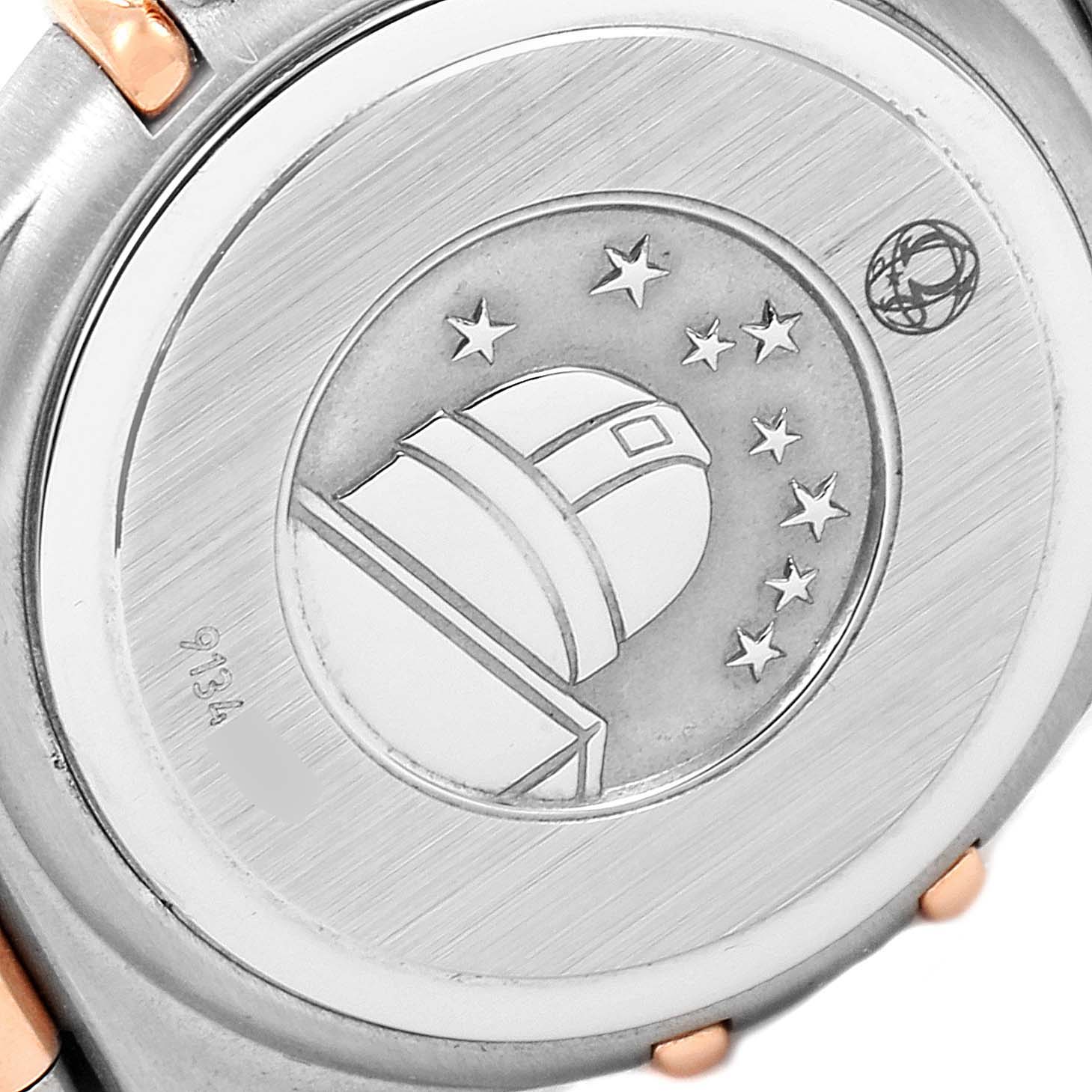 The image shows the back case of the Omega 1360.76.00 Women's Steel and Gold (two tone) Mother of Pearl Dial 1360.76.00 Women's Steel and Gold (two tone) Mother of Pearl Dial Constellation Mini Steel Rose Gold Diamond Watch 1360.76.00, featuring the engraved observatory logo.