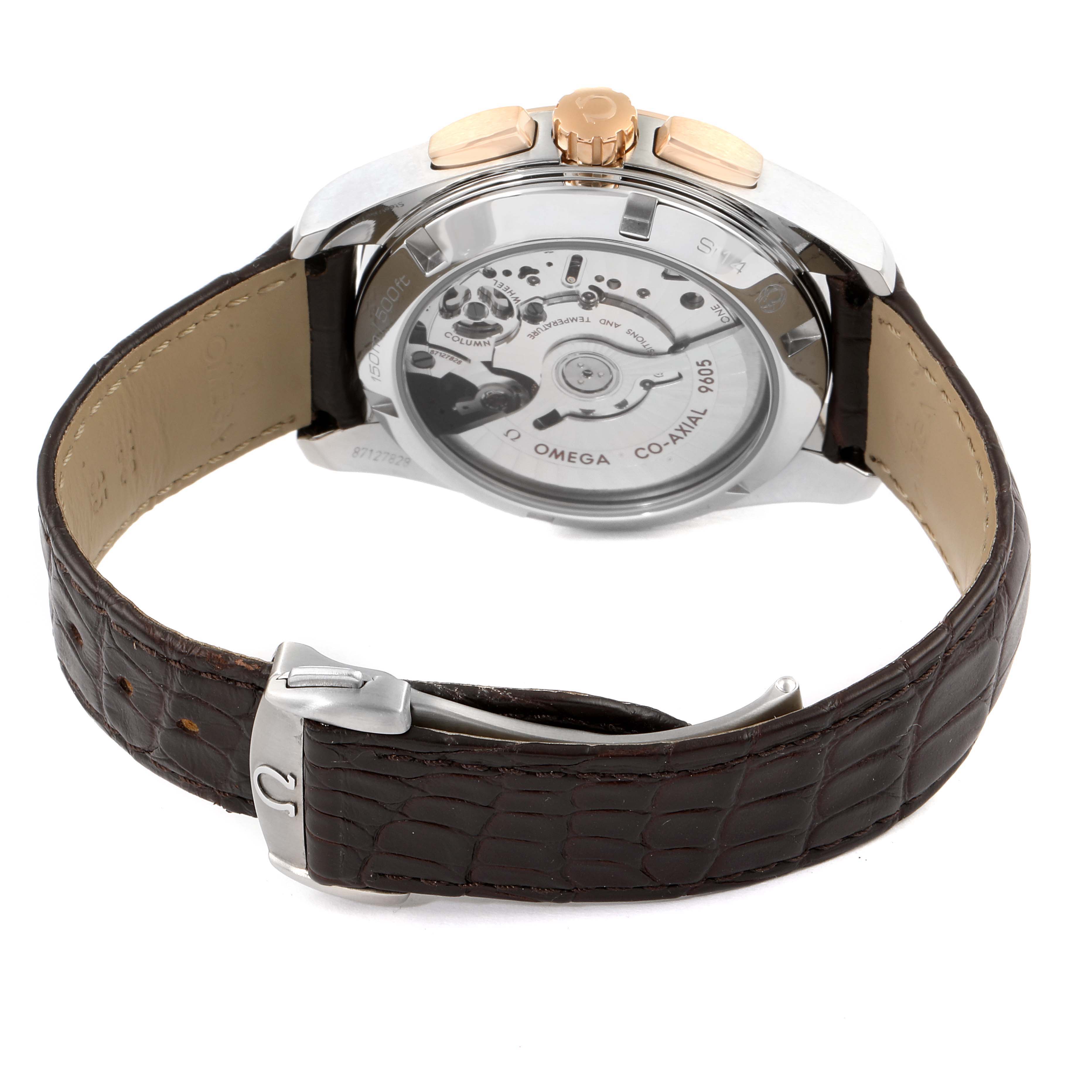 The image shows the back case and part of the strap of the Omega Aqua Terra 231.23.43.52.06.001 Men's Steel and Gold (two tone) Brown Dial 231.23.43.52.06.001 Men's Steel and Gold (two tone) Brown Dial watch, highlighting its movement and clasp.