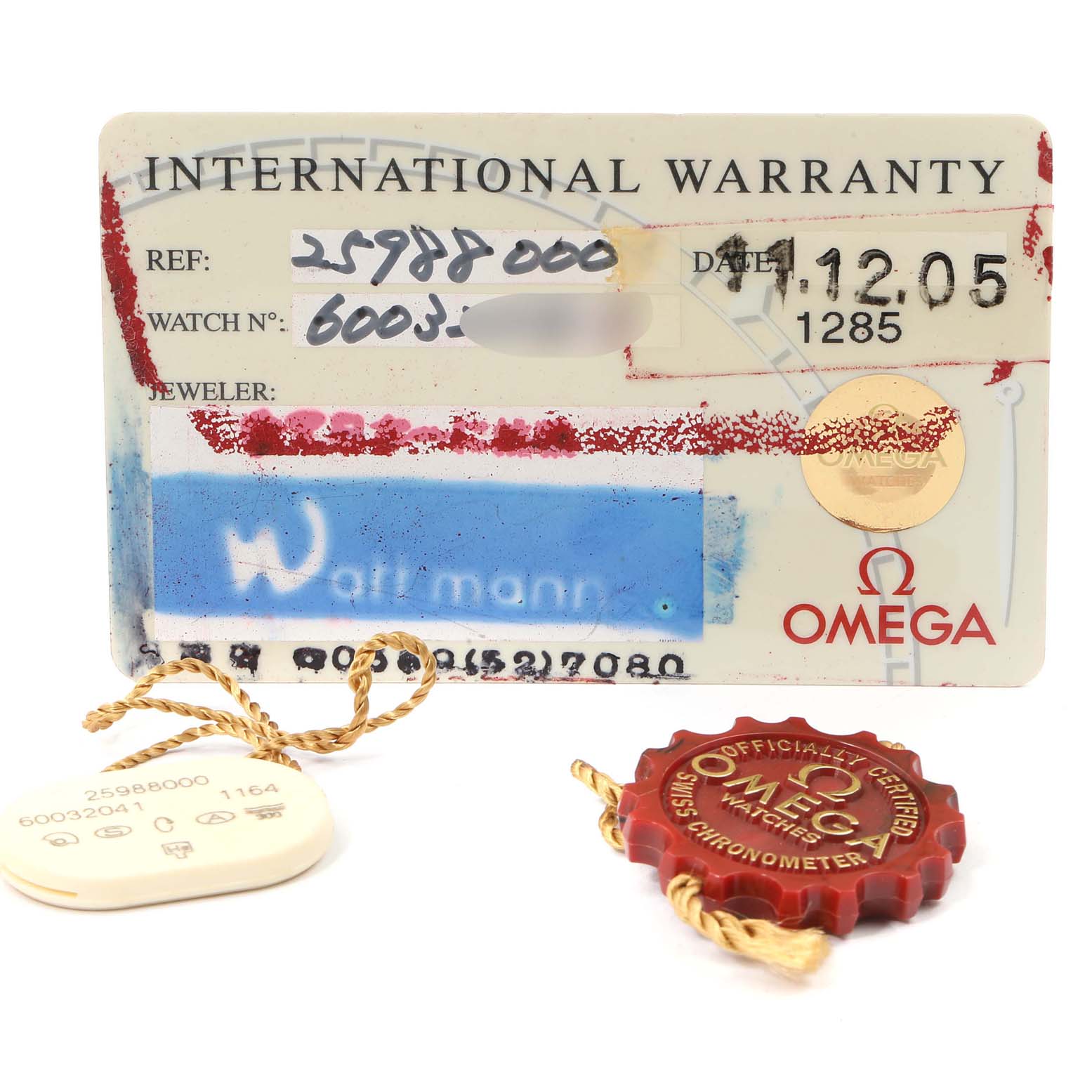 Shown are warranty cards and certification tags for an Omega Seamaster 2598.80.00 Men
s Stainless Steel Blue Dial 2598.80.00 Men
s Stainless Steel Blue Dial watch, displayed at a direct angle.