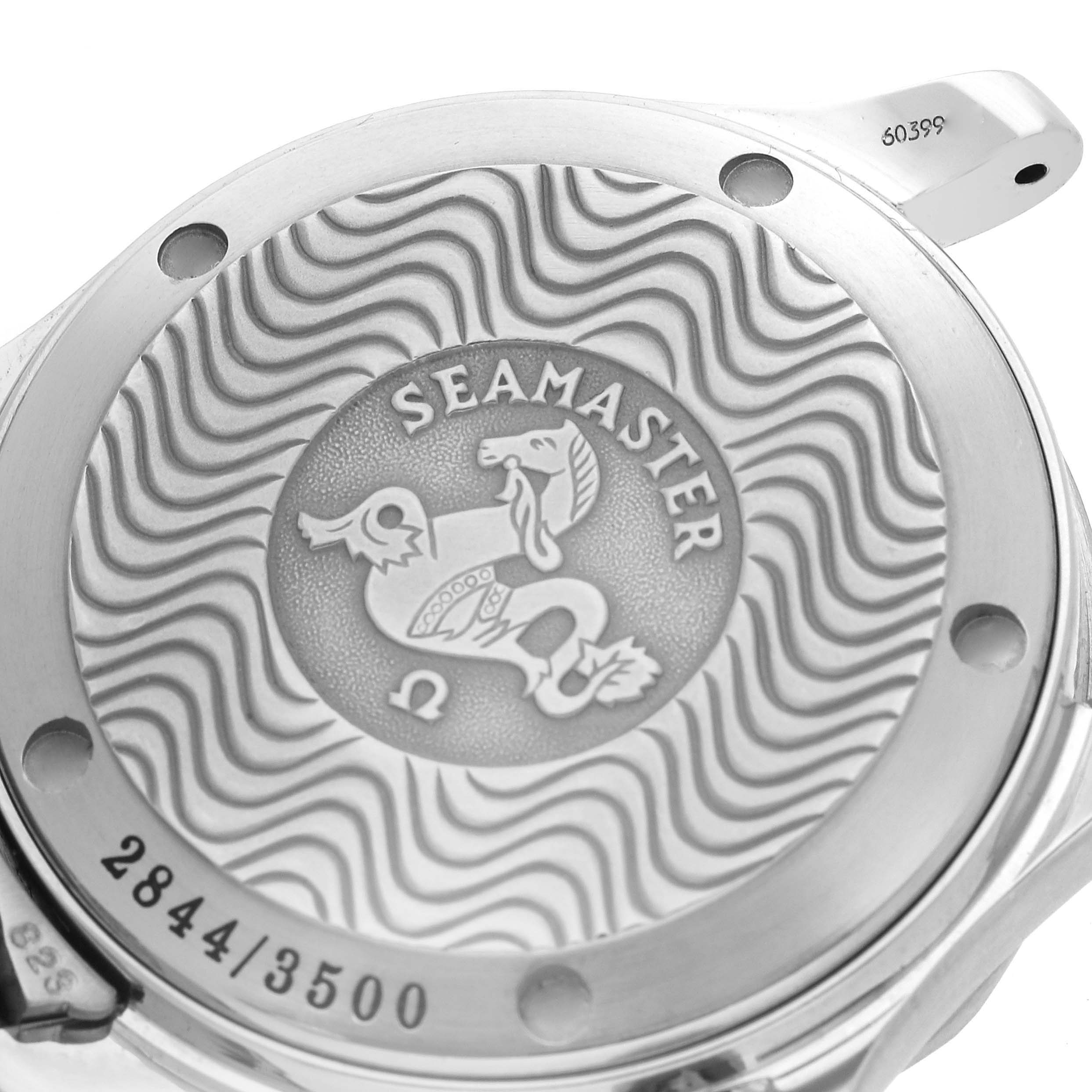 The image shows the back of an Omega Seamaster 2554.80.00 Men's Stainless Steel Blue Dial 2554.80.00 Men's Stainless Steel Blue Dial watch with engraved wave patterns and branding details.