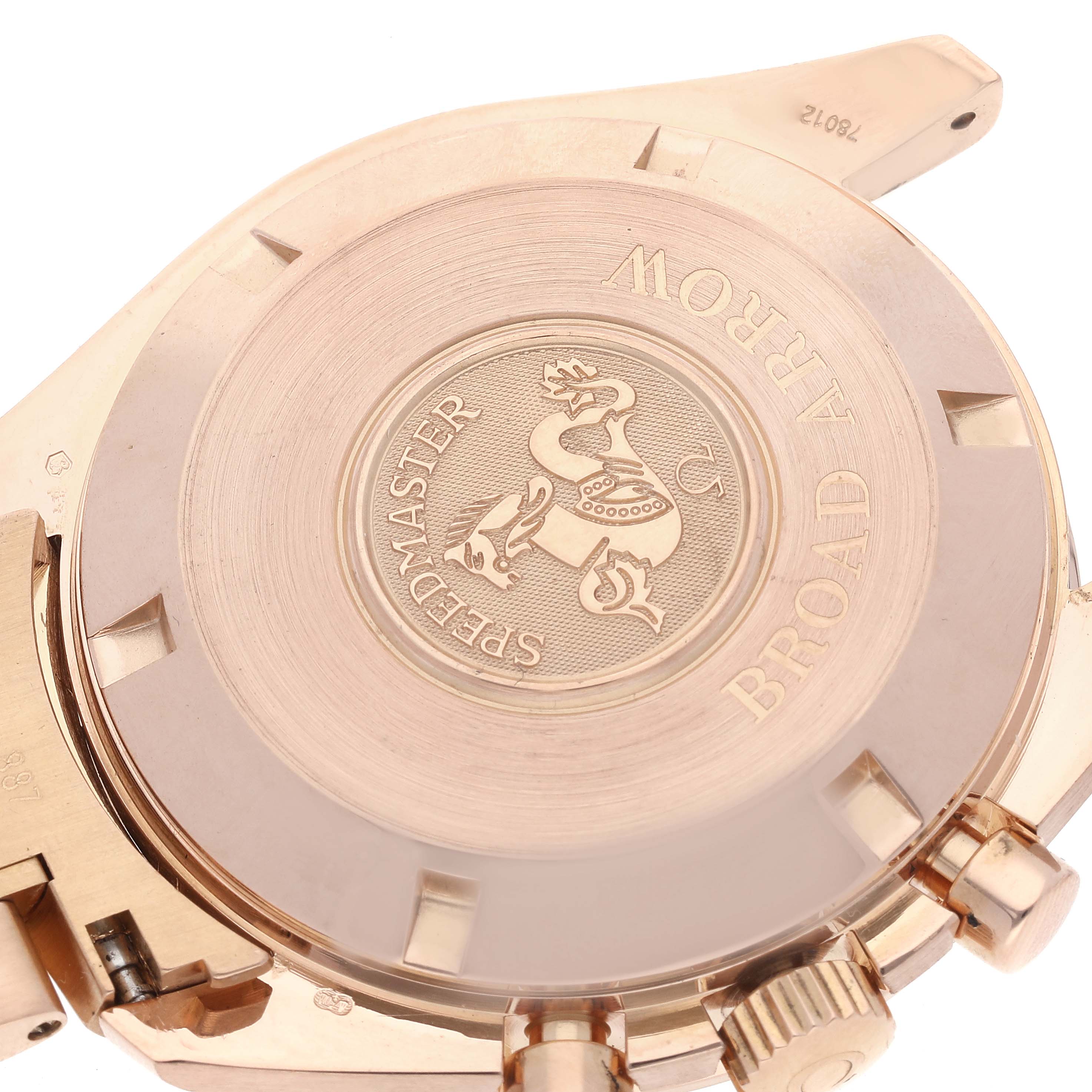 The image shows the back case and part of the crown of an Omega Speedmaster 3653.80.33 Men's Rose Gold Black Dial 3653.80.33 Men's Rose Gold Black Dial watch at a slight angle.