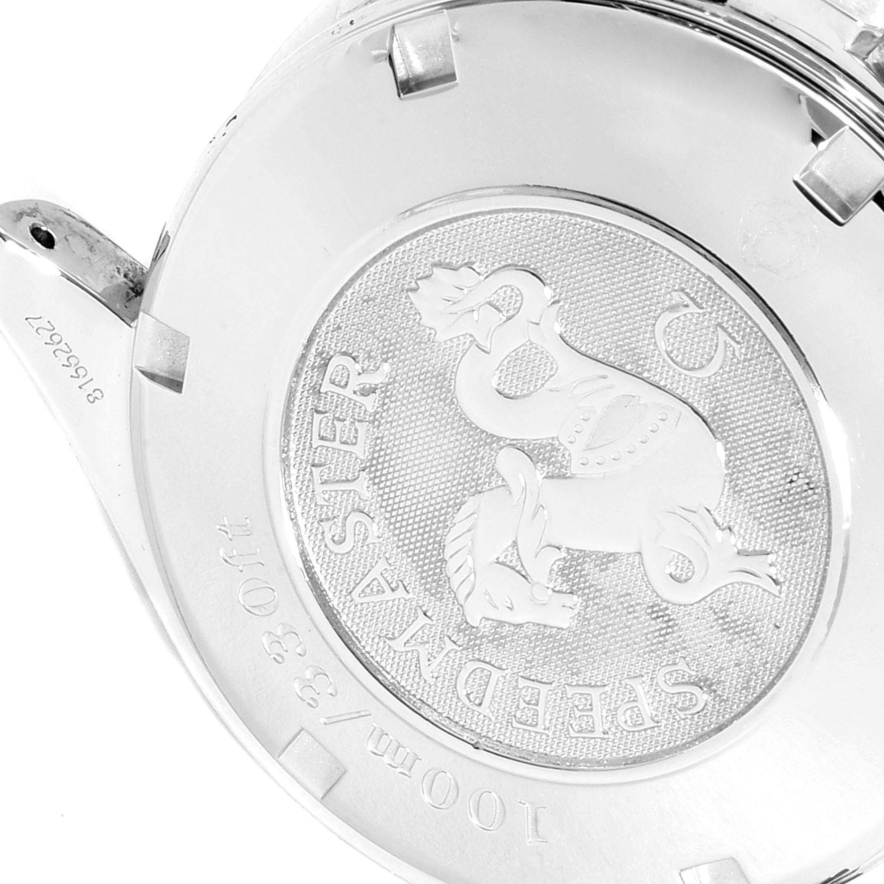 The image shows the case back of an Omega Speedmaster 3210.51.00 Men's Stainless Steel Black Dial 3210.51.00 Men's Stainless Steel Black Dial watch featuring its engraved logo and model details.