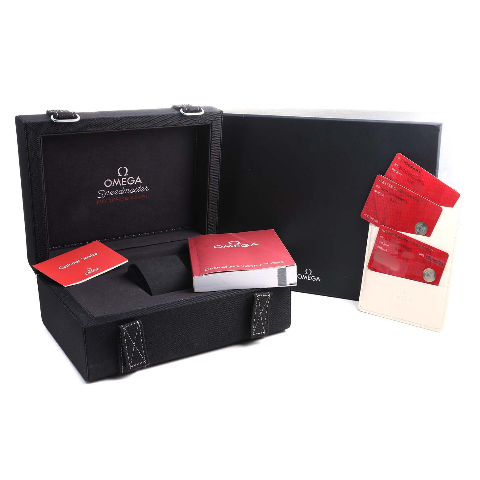 The image shows the Omega Speedmaster 310.62.42.50.99.001 Men's Yellow Gold Yellow Dial watch box, manuals, and warranty cards at a slight angle.