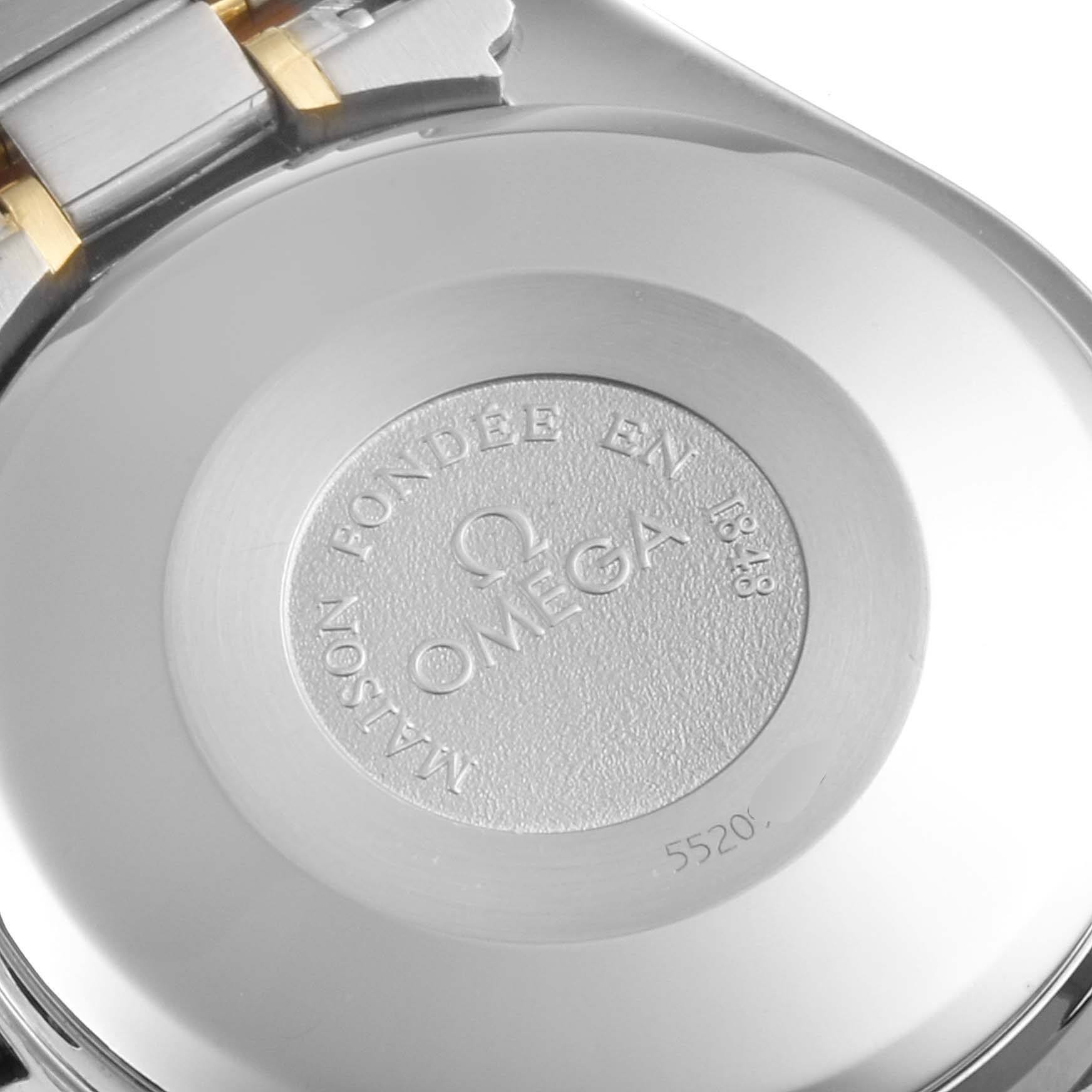 The image shows the backside of an Omega Speedmaster 3321.30.00 Men's Steel and Gold (two tone) Silver Dial 3321.30.00 Men's Steel and Gold (two tone) Silver Dial watch, focusing on the engraved details and part of the metal bracelet.