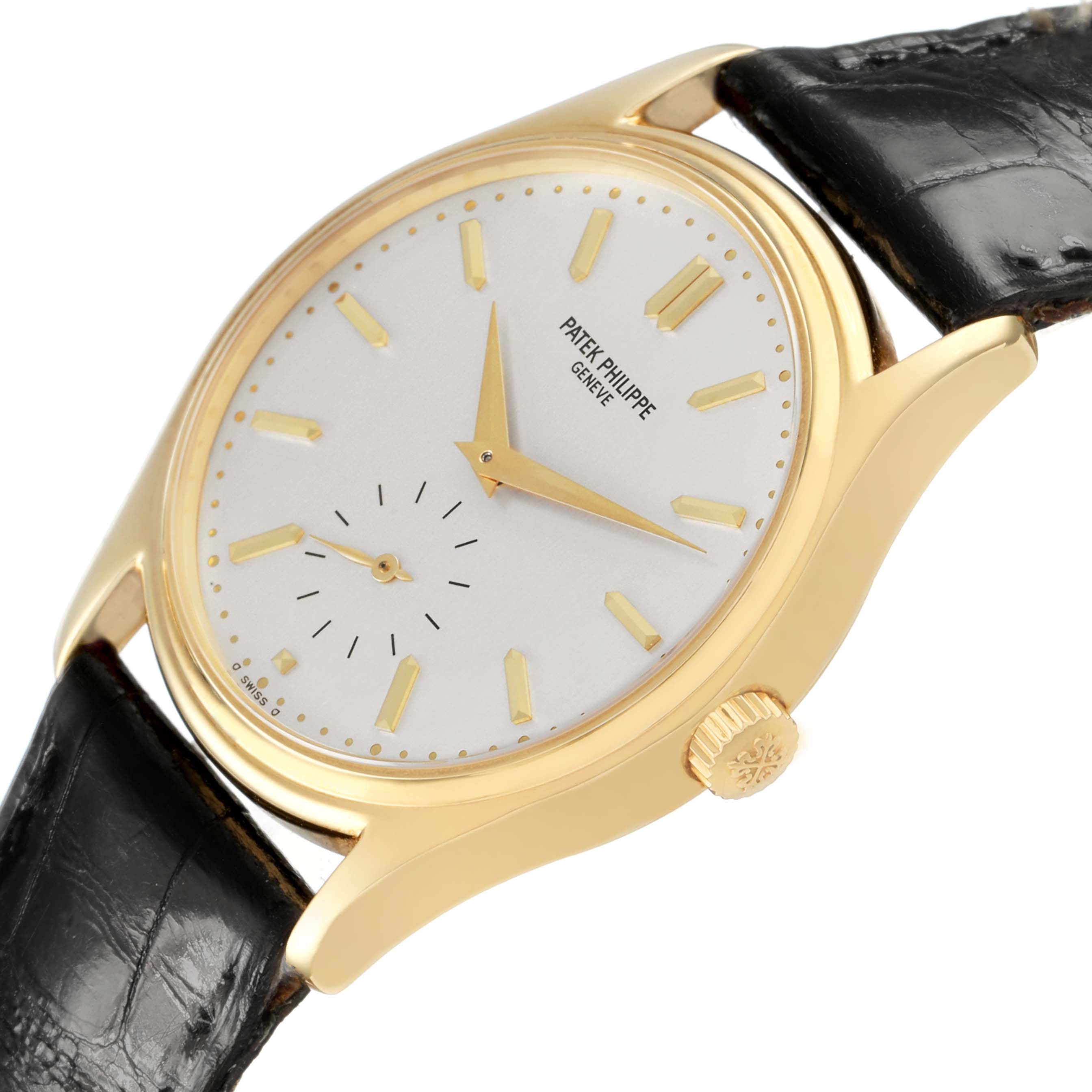 The image shows a side view of a Patek Philippe Calatrava 5023 5023J Men's Yellow Gold Silver Dial watch highlighting its gold case, crown, dial, and leather strap.