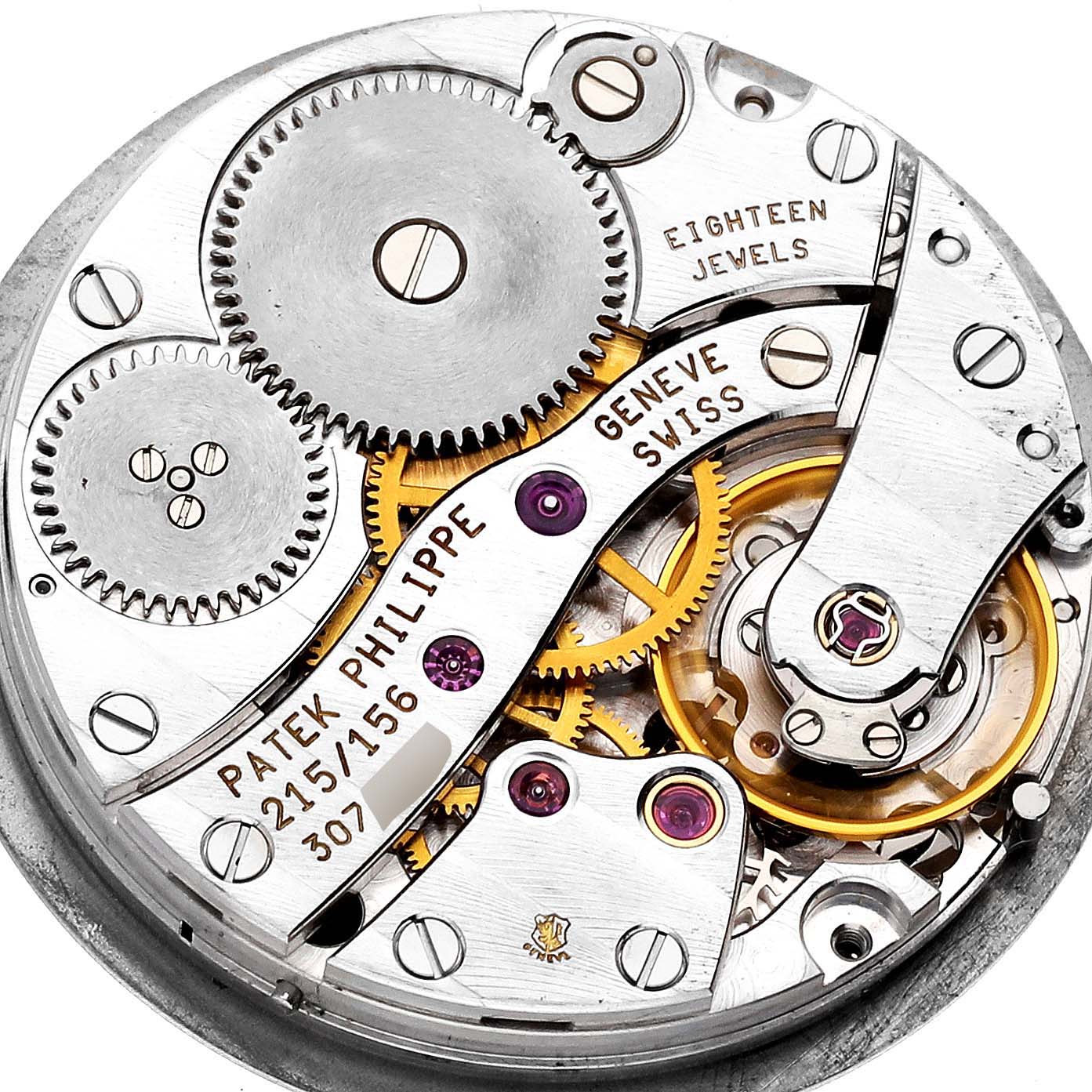 The image shows the intricate internal movement mechanism of a Patek Philippe Calatrava 4864J Women's Yellow Gold White Dial 4864J Women's Yellow Gold White Dial watch, focusing on its gears and components.