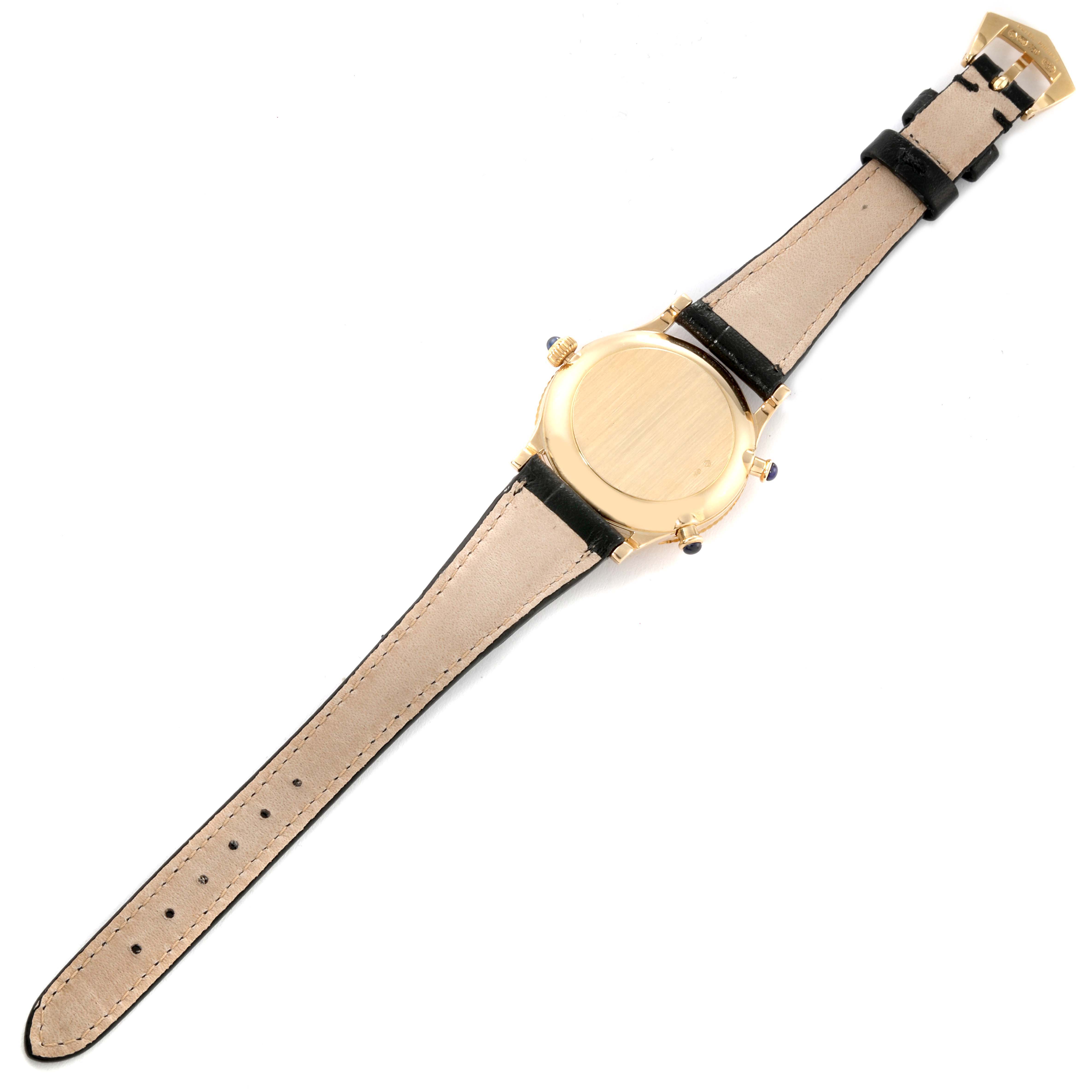 This image shows the back of a Patek Philippe Calatrava 4864J Women's Yellow Gold White Dial 4864J Women's Yellow Gold White Dial watch, highlighting its case and leather strap.