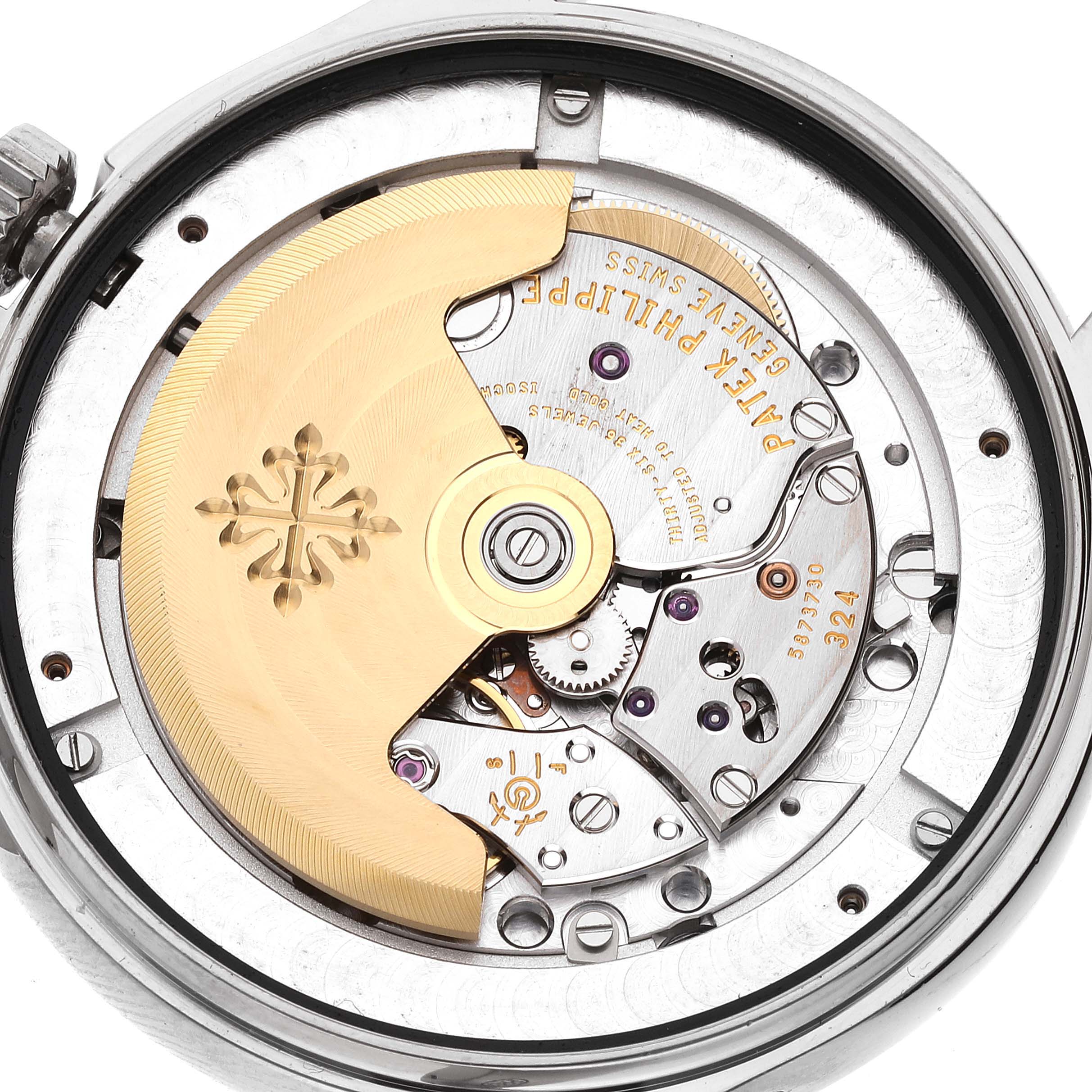 This image shows a close-up of the movement and rotor of a Patek Philippe Complications 5146G Men's White Gold Beige Dial 5146G Men's White Gold Beige Dial model watch from the back.