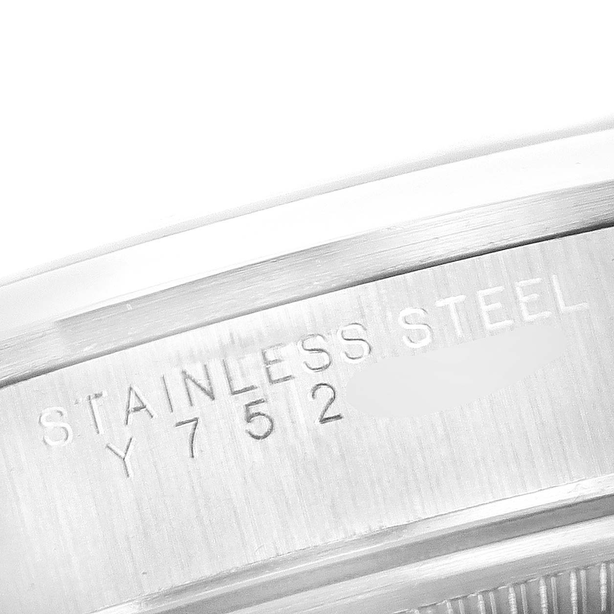 This image shows a close-up of the side engraving on the stainless steel case of the Rolex Air-King 14000 Men's Stainless Steel Blue Dial 14000 Men's Stainless Steel Blue Dial watch.
