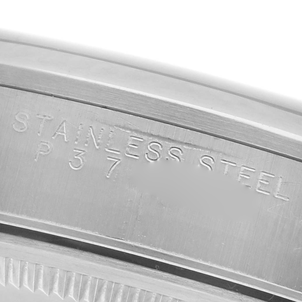 The image shows a close-up of the case's edge for the Rolex Air-King 14000 Men's Stainless Steel Black Dial 14000 Men's Stainless Steel Black Dial, highlighting the stainless steel engraving.