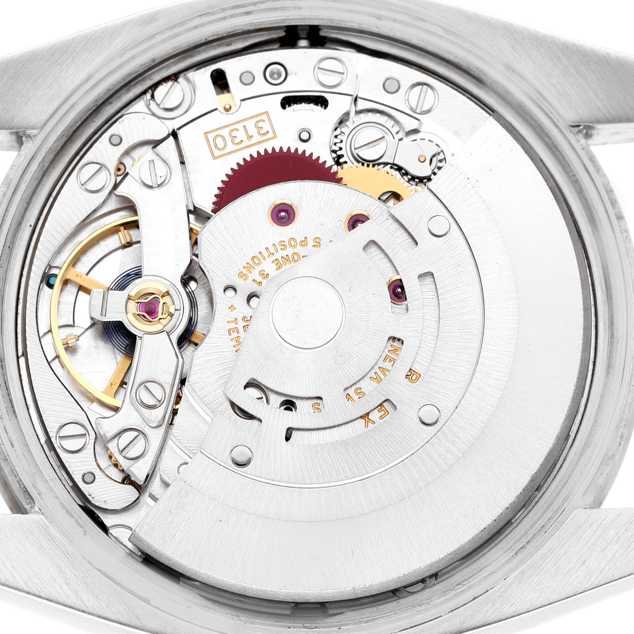 The image shows the movement of a Rolex Air-King 114234 Men's Stainless Steel Silver Dial watch from a top-down angle, highlighting internal components.