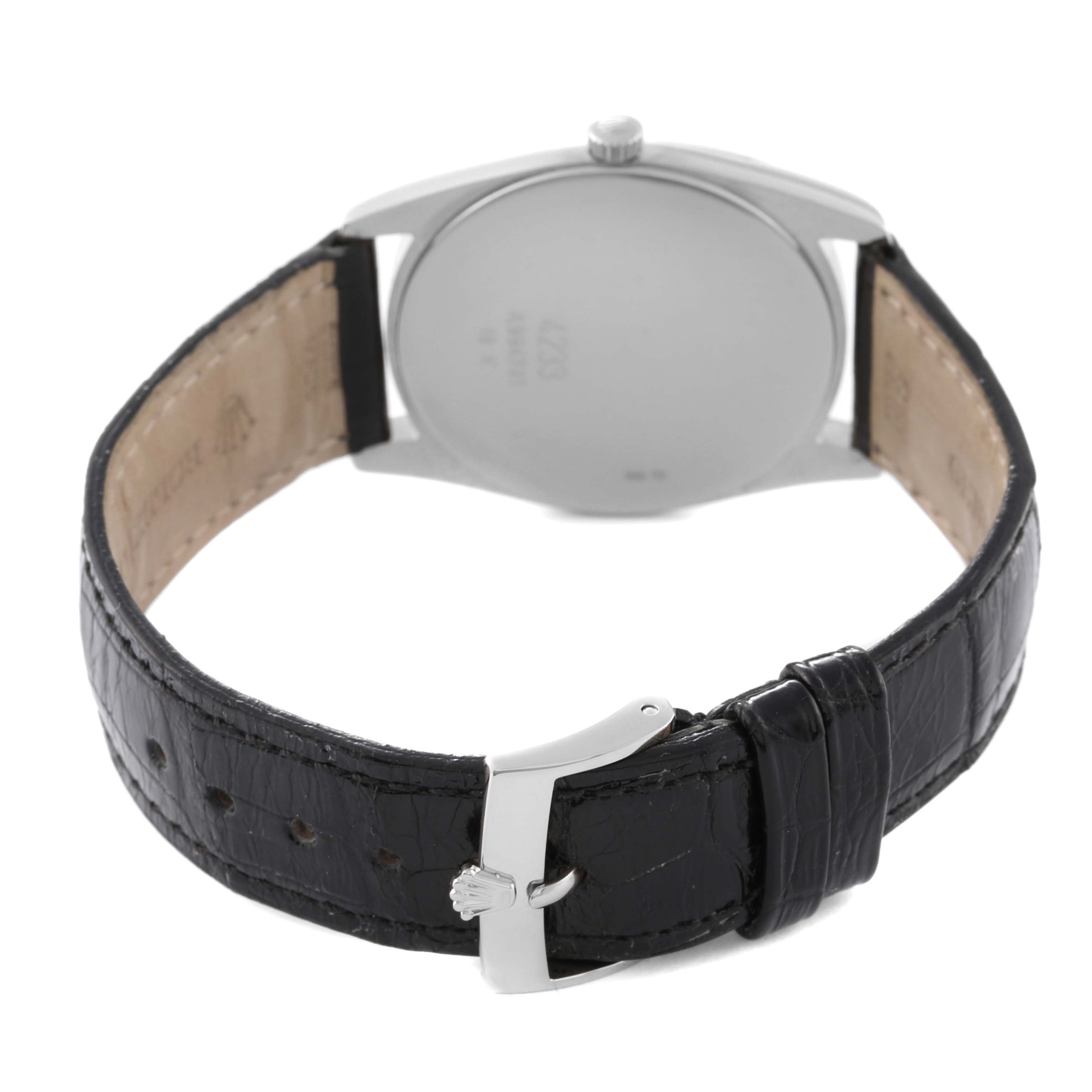 The image shows the back view of a Rolex Cellini 4233/9 Men's White Gold Black Dial 4233/9 Men's White Gold Black Dial watch, featuring its case back, strap interior, and buckle.