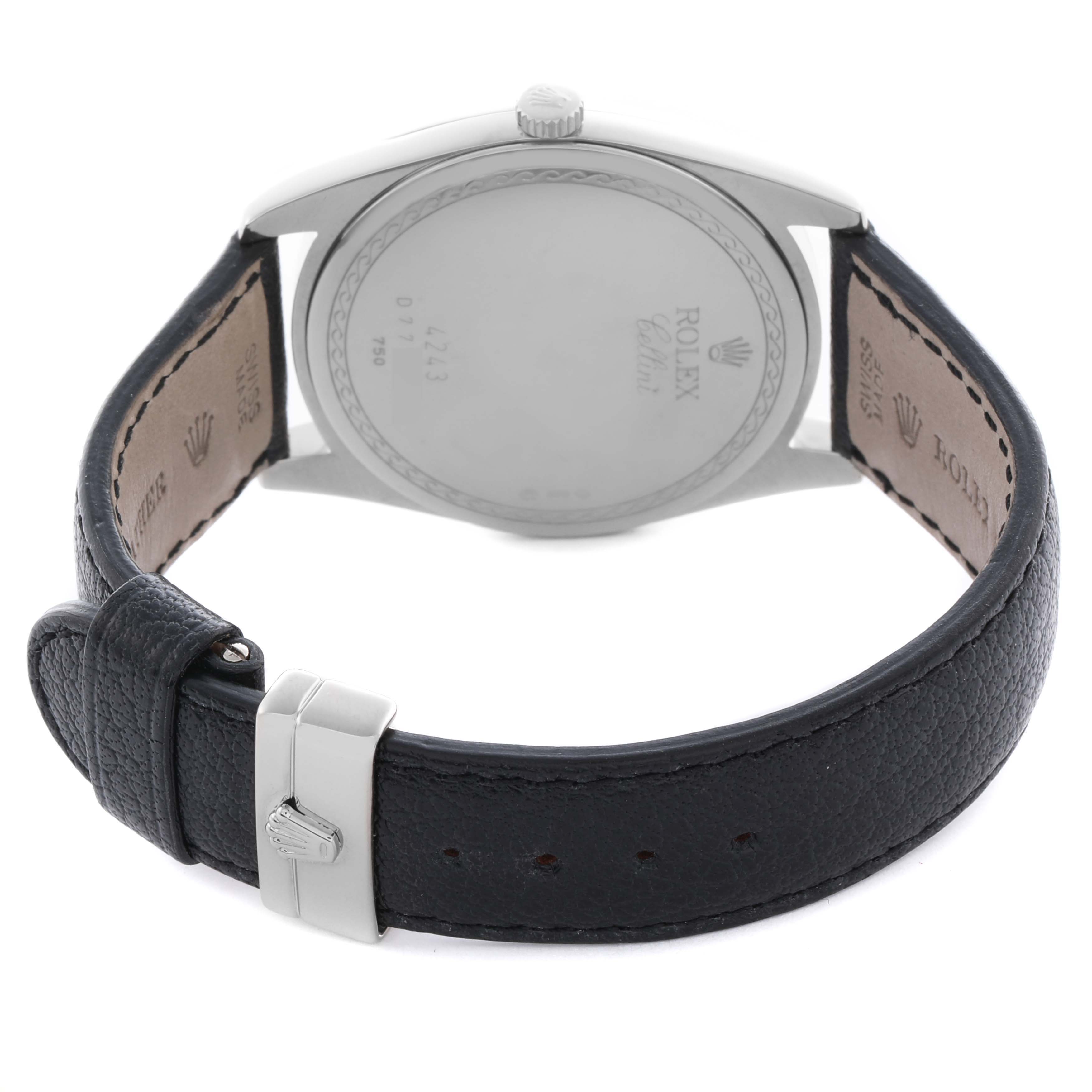The Rolex Cellini 4243/9 Men's White Gold Silver Dial 4243/9 Men's White Gold Silver Dial watch is shown from the back, highlighting the case back and leather strap with a visible buckle.
