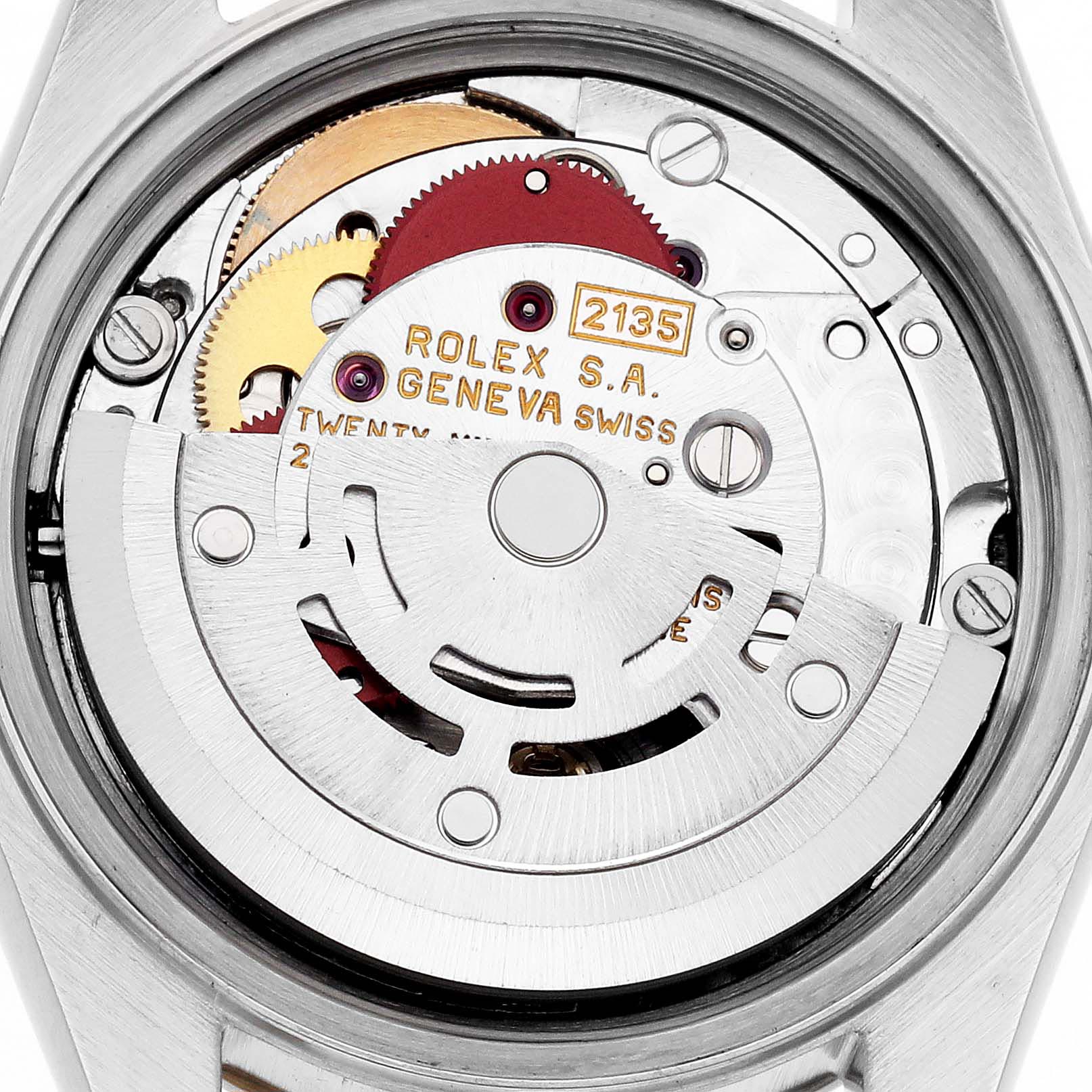 The image shows the movement of a Rolex Date 69173 Women's Steel and Gold (two tone) Black Dial 69173 Women's Steel and Gold (two tone) Black Dial, viewed from the back, highlighting the rotor and gears.