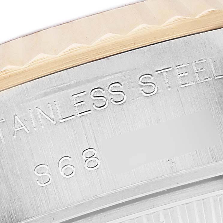 The image shows a close-up of the stainless steel case back of a Rolex Date 69173 Women's Steel and Gold (two tone) Black Dial 69173 Women's Steel and Gold (two tone) Black Dial watch with engraved markings.