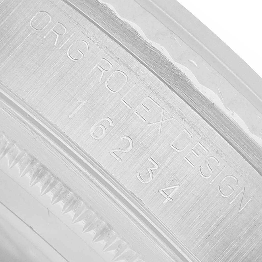 The image shows a close-up of the Rolex Datejust 16234 Men's Steel and Gold (two tone) Silver Dial's side case, displaying the engraved model number.