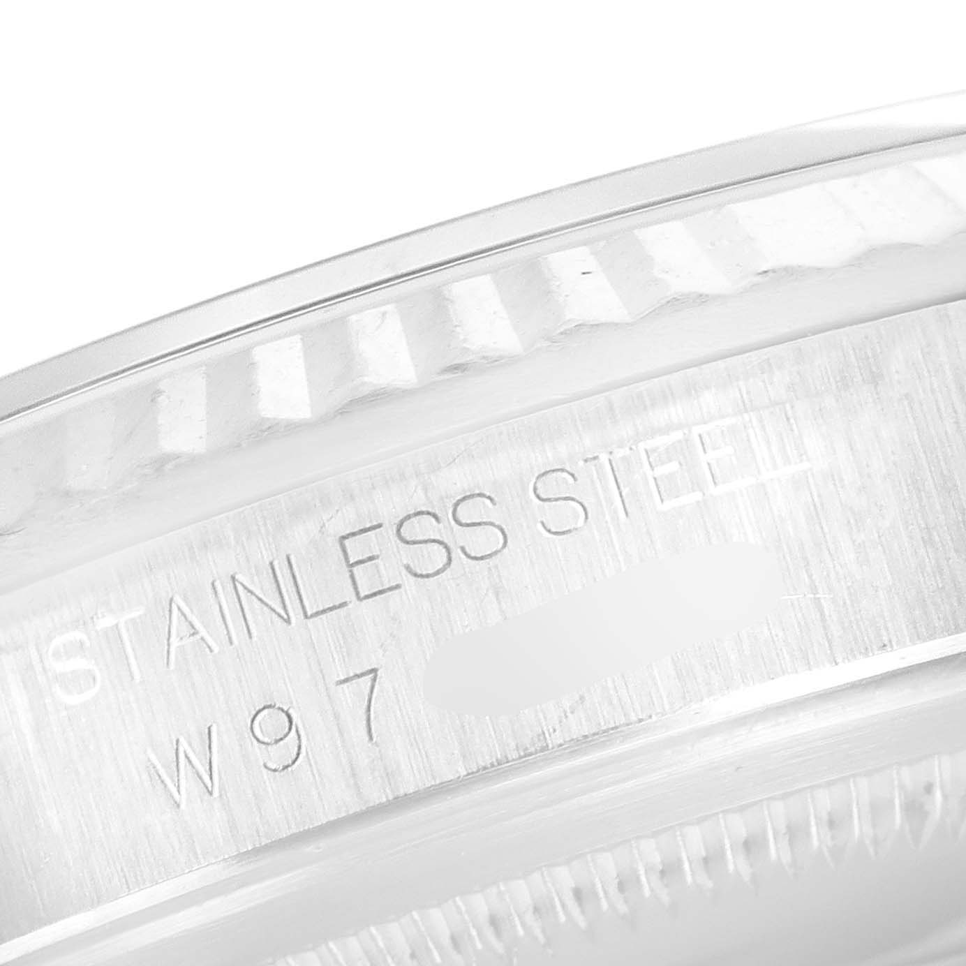 The image shows a close-up of the stainless steel casing of a Rolex Datejust 16234 Men's Stainless Steel Pink Dial 16234 Men's Stainless Steel Pink Dial watch, highlighting the inscription.