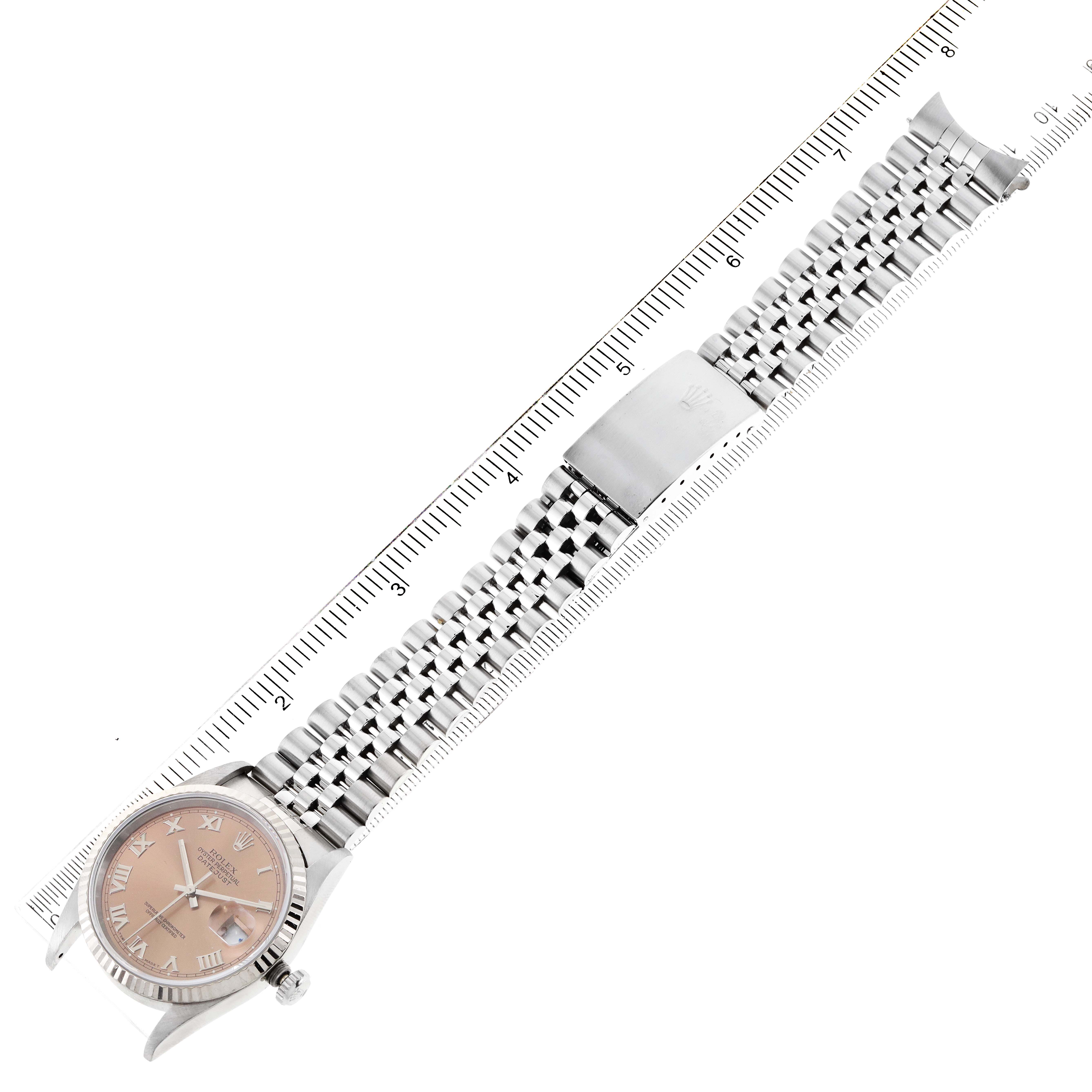 The image shows a Rolex Datejust 16234 Men's Stainless Steel Pink Dial 16234 Men's Stainless Steel Pink Dial watch from a top view, highlighting its bracelet, clasp, and pink dial.