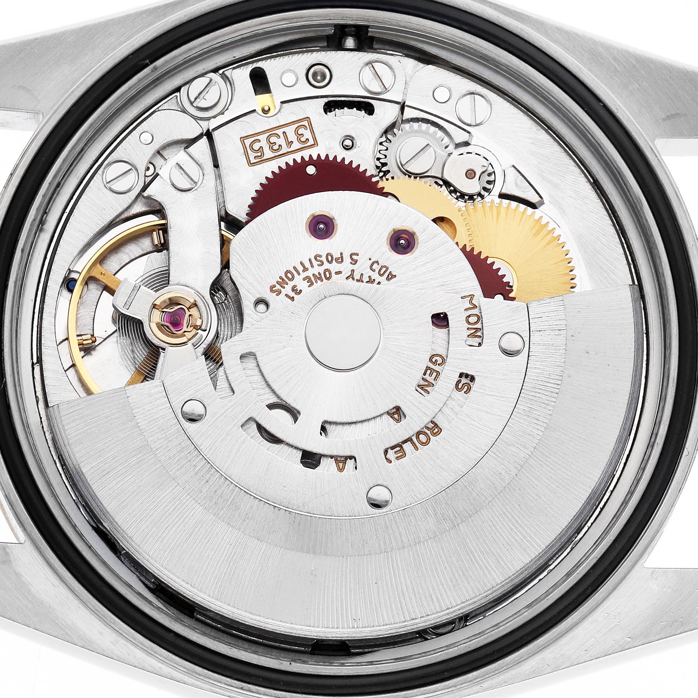 The image shows the Rolex Datejust 16233 Men's Steel and Gold (two tone) Champagne Dial 16233 Men's Steel and Gold (two tone) Champagne Dial's movement mechanism, viewed from the back, revealing gears, rotors, and engravings.