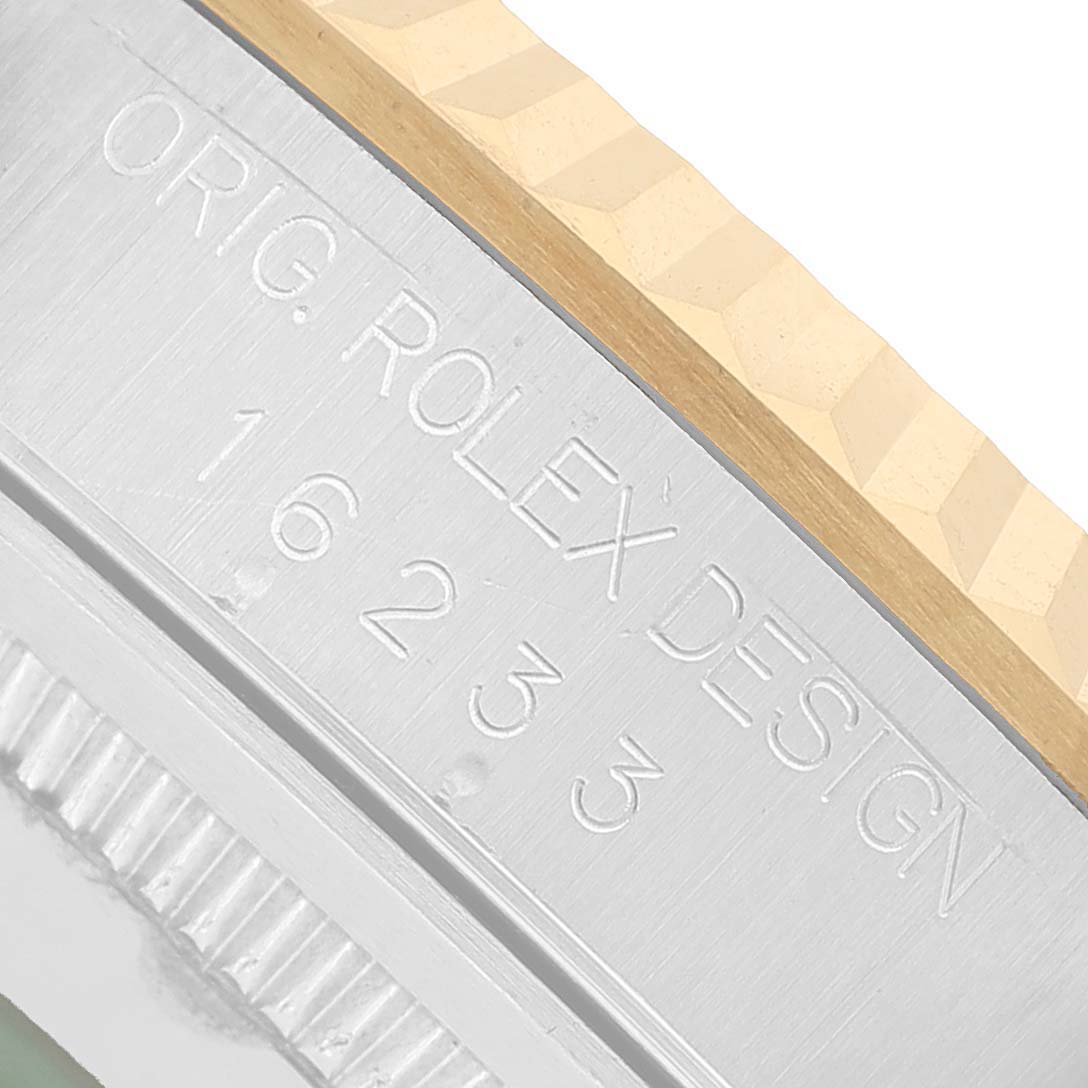 The image shows a close-up of the side casing of a Rolex Datejust 16233 Men's Steel and Gold (two tone) White Dial, highlighting the model number engraving.