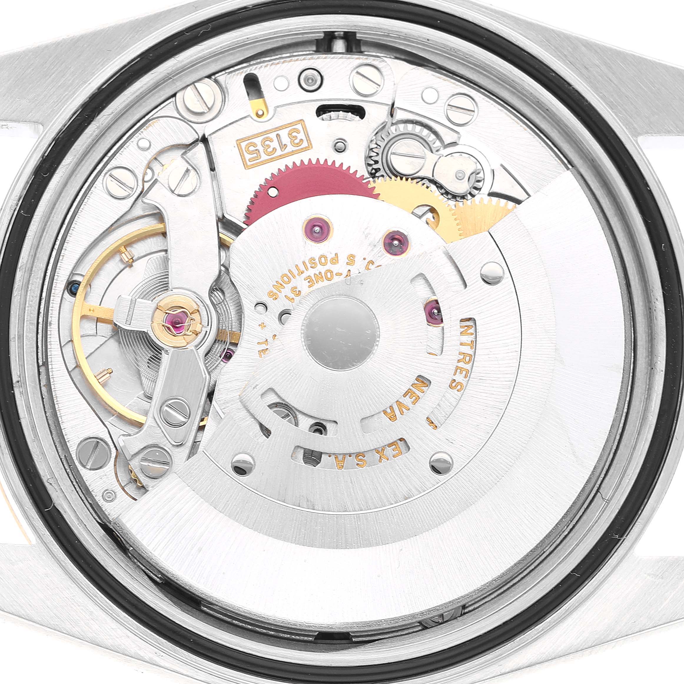 The image shows the movement of a Rolex Datejust 16233 Men's Steel and Gold (two tone) White Dial watch, highlighting its intricate components from a back angle.
