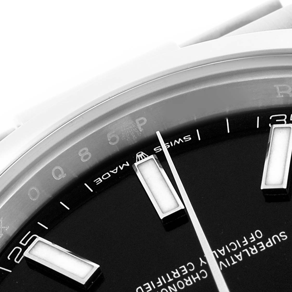 The image shows a close-up of the Rolex Datejust 41 126300 Men's Stainless Steel Black Dial 126300 Men's Stainless Steel Black Dial's dial at an angle, highlighting indices and part of the bezel.