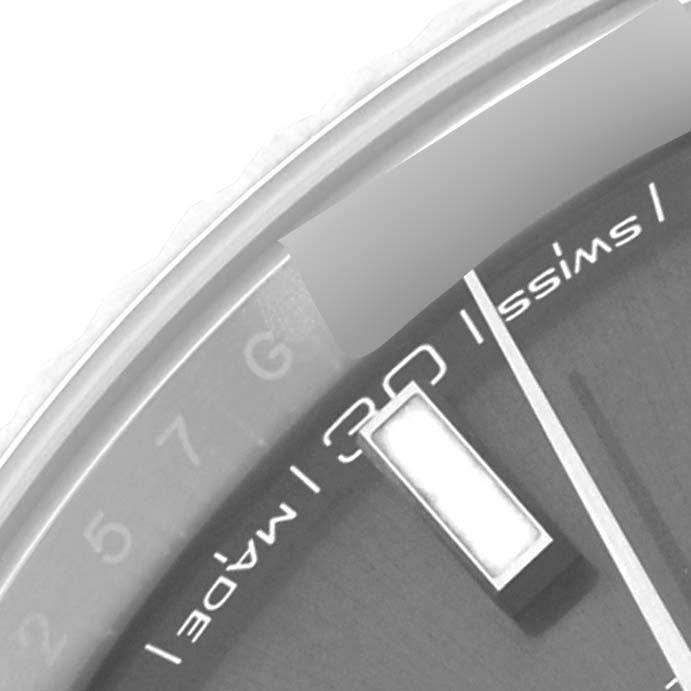 The image shows a close-up of the dial
s edge and marker of a Rolex Datejust 41 126334 Men
s Stainless Steel Grey Dial 126334 Men
s Stainless Steel Grey Dial watch, focusing on the "Swiss made" text and numeral marker.