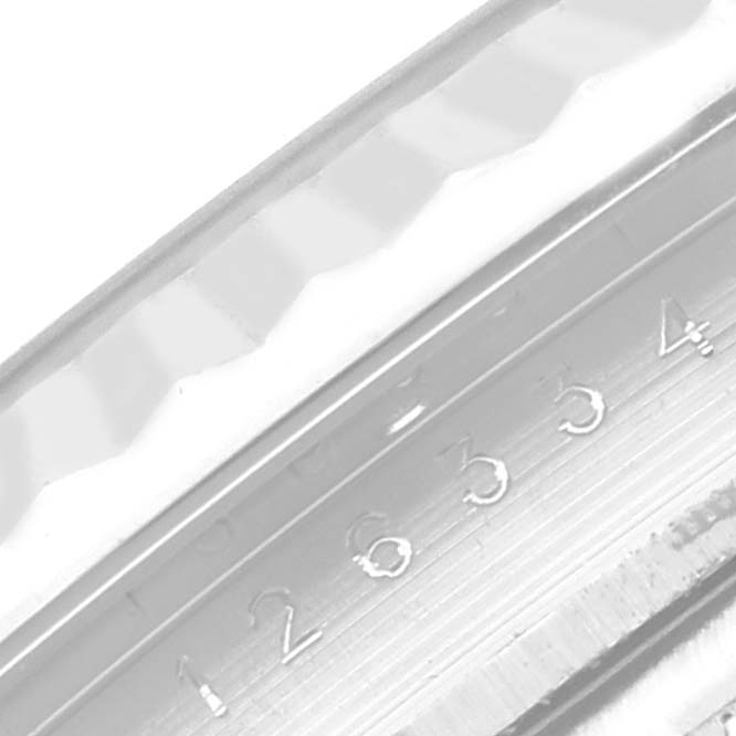 This image shows a close-up of the fluted bezel and engraved serial number of the Rolex Datejust 41 126334 Men
s Stainless Steel Grey Dial 126334 Men
s Stainless Steel Grey Dial watch.