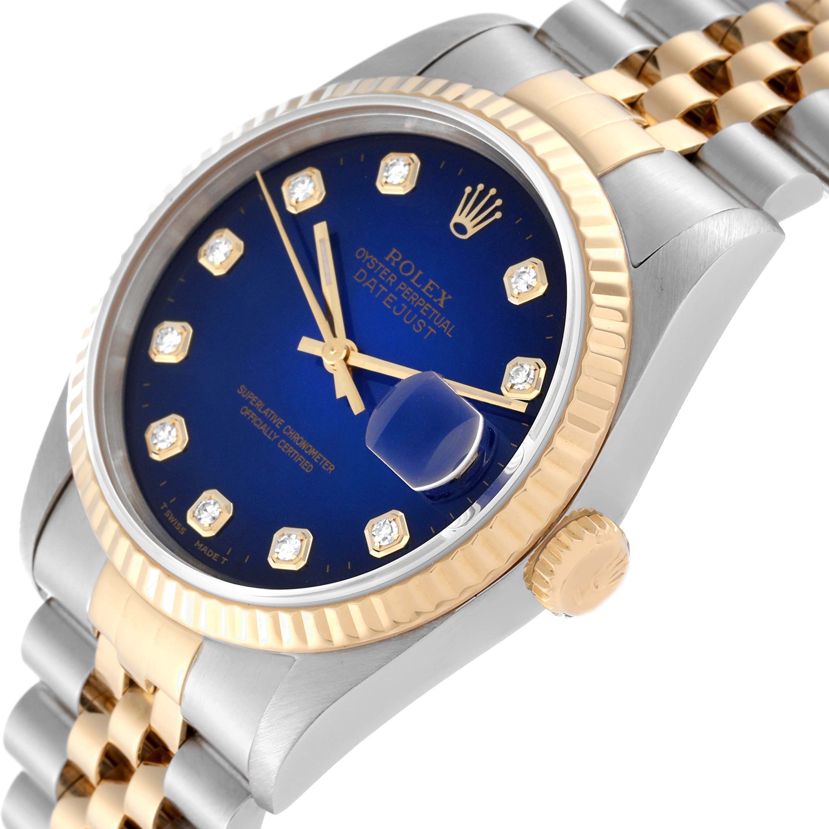This image shows a close-up, angled view of the Rolex Datejust 16233 Men's Steel and Gold (two tone) Blue Dial 16233 Men's Steel and Gold (two tone) Blue Dial watch face, bezel, and part of the bracelet.