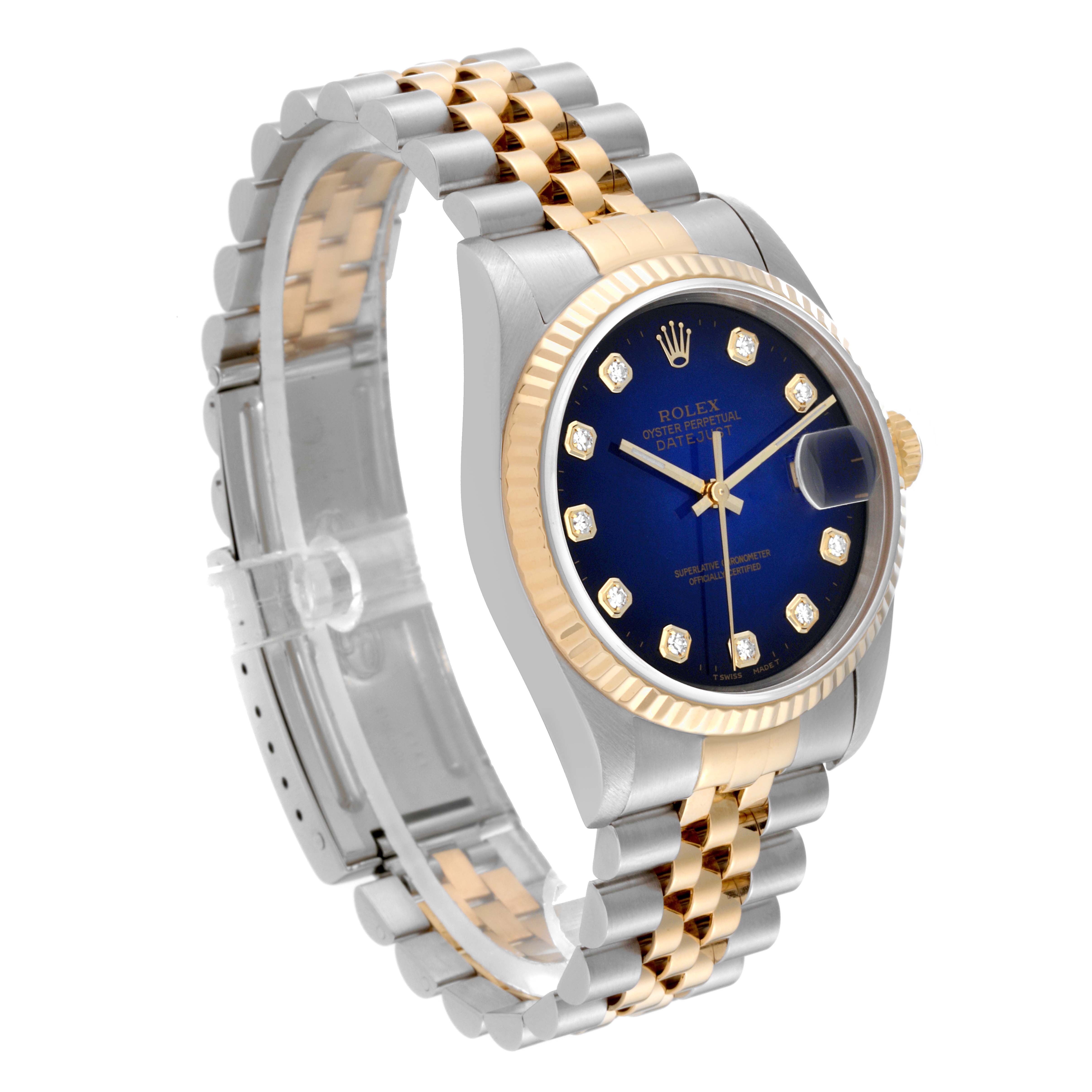 The Rolex Datejust 16233 Men's Steel and Gold (two tone) Blue Dial 16233 Men's Steel and Gold (two tone) Blue Dial watch is shown at a three-quarter angle, displaying its dial, case, bezel, crown, and bracelet.