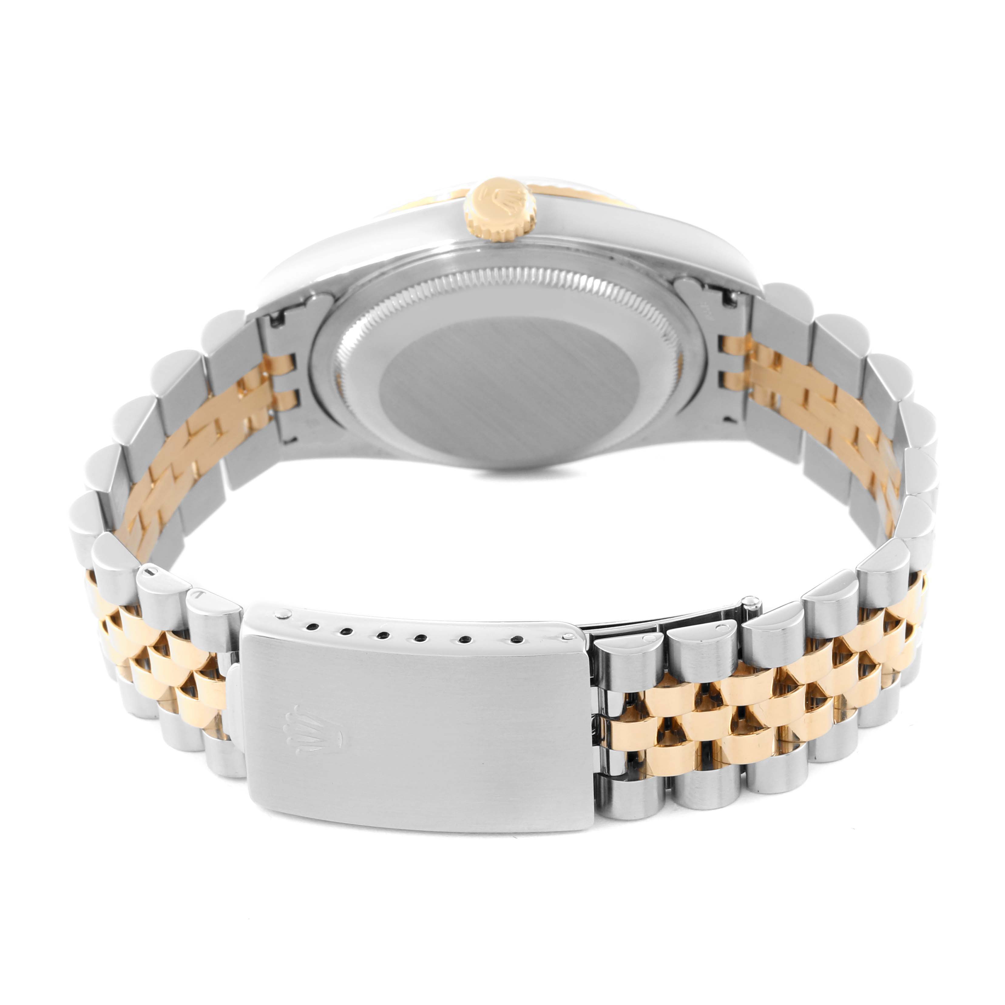 This image shows the back and bracelet of a Rolex Datejust 16233 Men's Steel and Gold (two tone) Blue Dial 16233 Men's Steel and Gold (two tone) Blue Dial watch from an angle focusing on the clasp and case back.