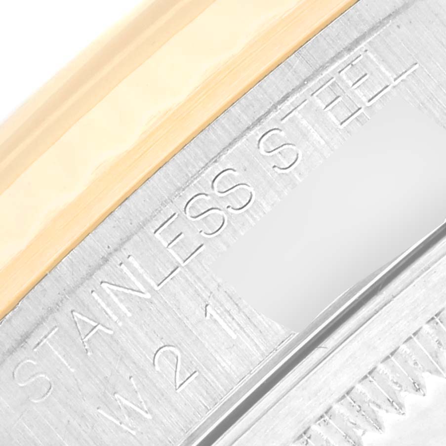 The close-up image showcases the edge of a Rolex Datejust 16233 Men's Steel and Gold (two tone) Blue Dial 16233 Men's Steel and Gold (two tone) Blue Dial with text indicating "STAINLESS STEEL."