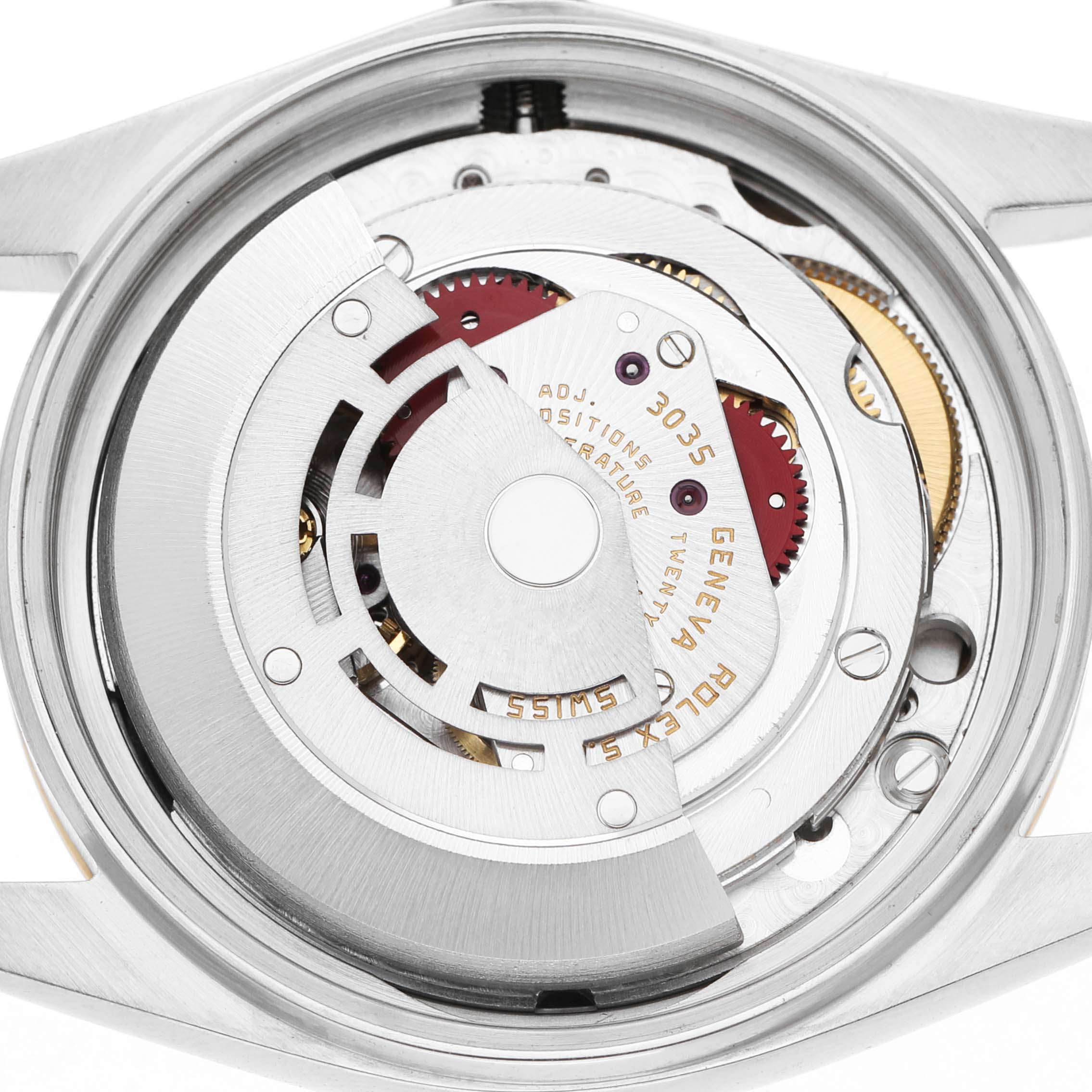 The image shows the movement of a Rolex Datejust 16013 Men's Steel and Gold (two tone) Champagne Dial watch, viewed from the back, highlighting its intricate mechanical parts.