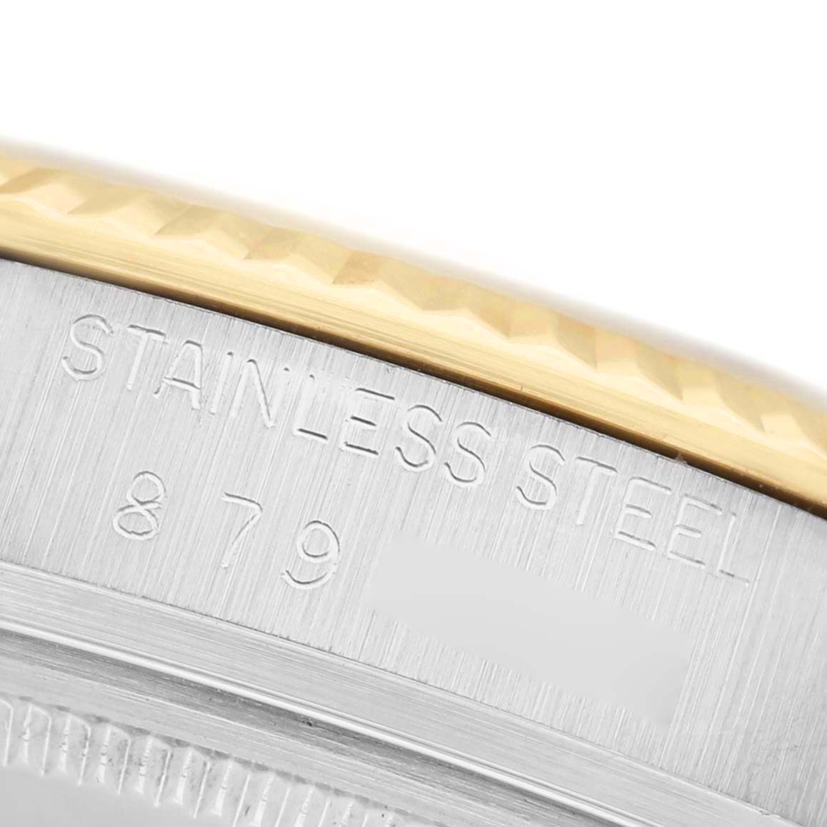 The image shows a close-up of the case edge and fluted bezel of a Rolex Datejust 16013 Men's Steel and Gold (two tone) Champagne Dial, highlighting the "Stainless Steel" engraving.