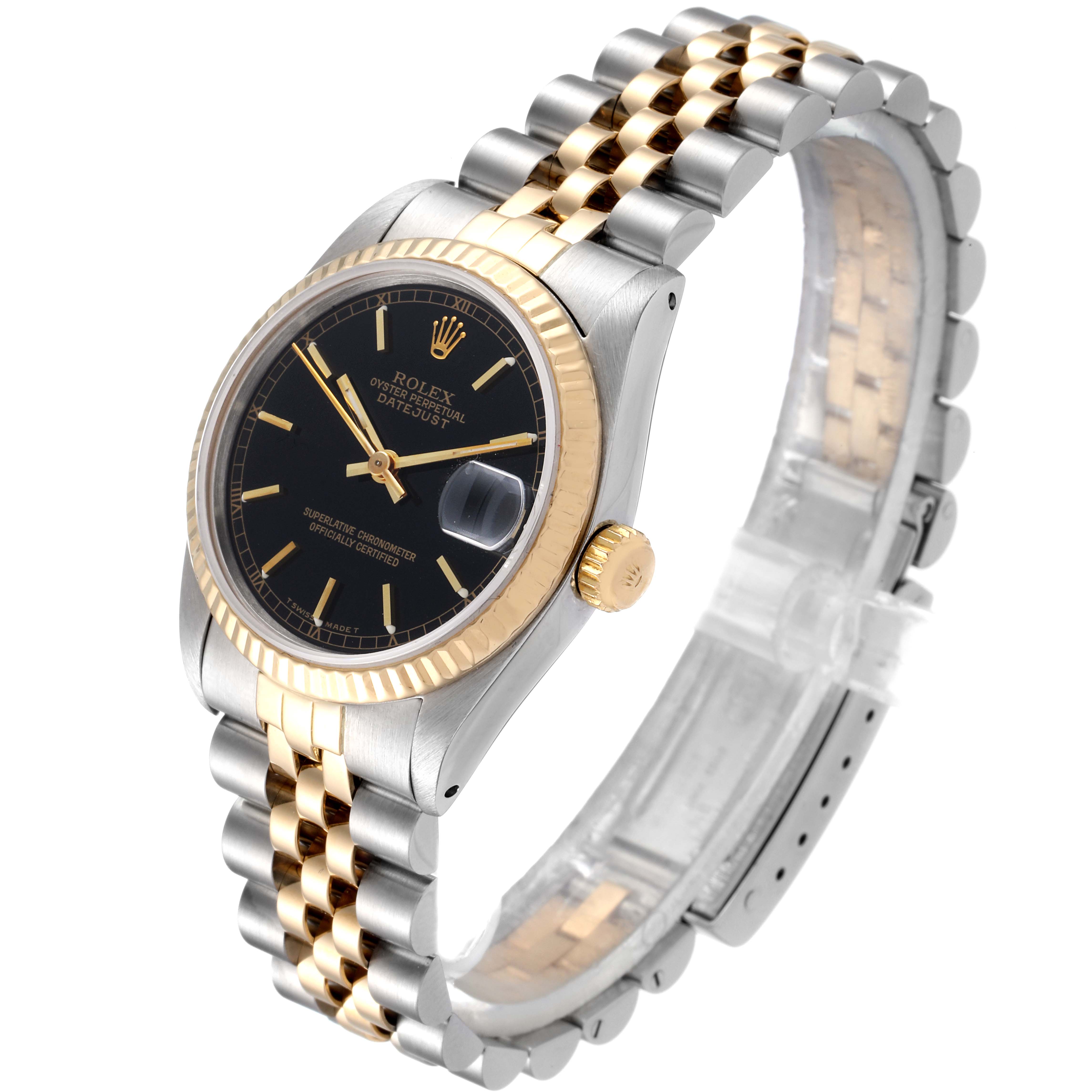 This image shows a Rolex Mid-Size 68273 Women
s Steel and Gold (two tone) Black Dial 68273 Women
s Steel and Gold (two tone) Black Dial Datejust watch at an angle displaying its black dial, two-tone bracelet, fluted bezel, and crown.