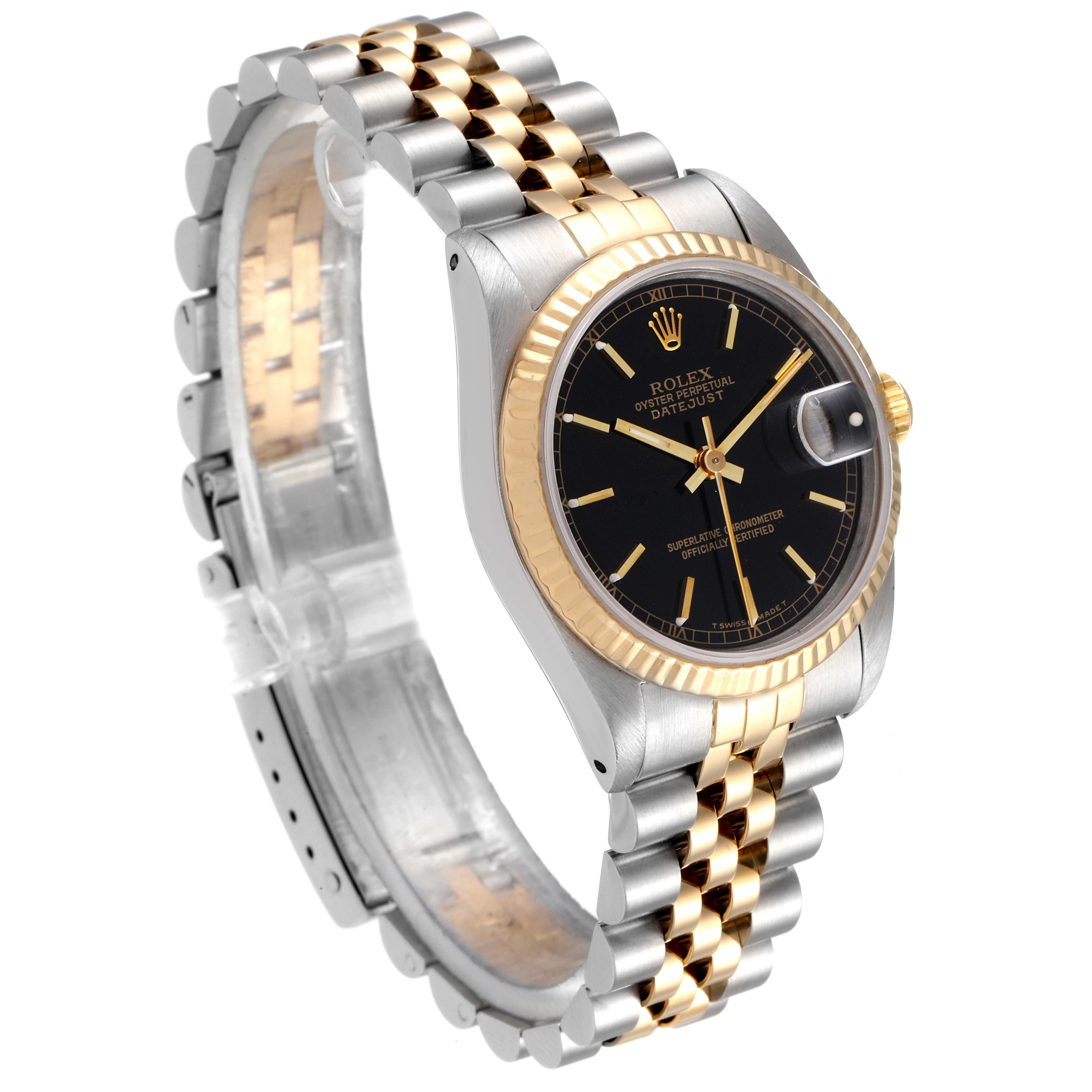 The image shows a side angle of a Rolex Mid-Size 68273 Women
s Steel and Gold (two tone) Black Dial 68273 Women
s Steel and Gold (two tone) Black Dial watch, highlighting its two-tone bracelet and black dial with gold accents.