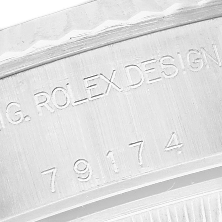 The image shows an engraved side view of a Rolex Datejust 79174 Women's Stainless Steel Mother of Pearl Dial 79174 Women's Stainless Steel Mother of Pearl Dial case with serial and model numbers visible.