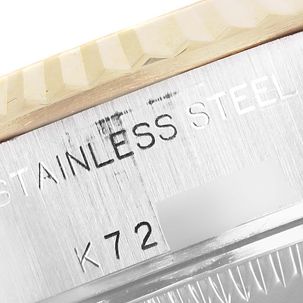 This image shows a close-up angle of the watch case back and part of the bezel of the Rolex Datejust 79173 Women's Steel and Gold (two tone) Blue Dial 79173 Women's Steel and Gold (two tone) Blue Dial model.