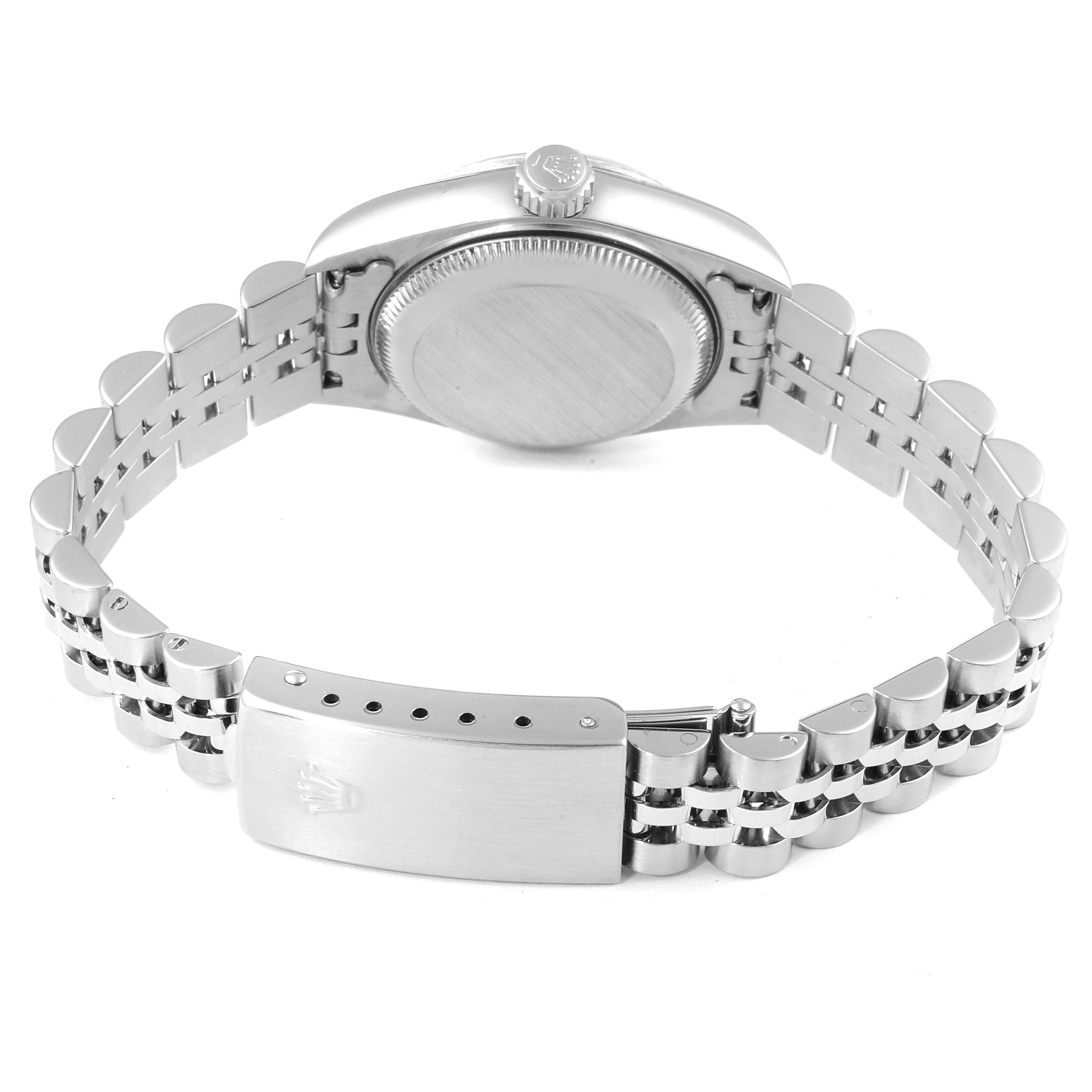 The image shows the back angle of a Rolex Datejust 79174 Women's Stainless Steel White Dial 79174 Women's Stainless Steel White Dial watch, highlighting the case, crown, and bracelet with the clasp.