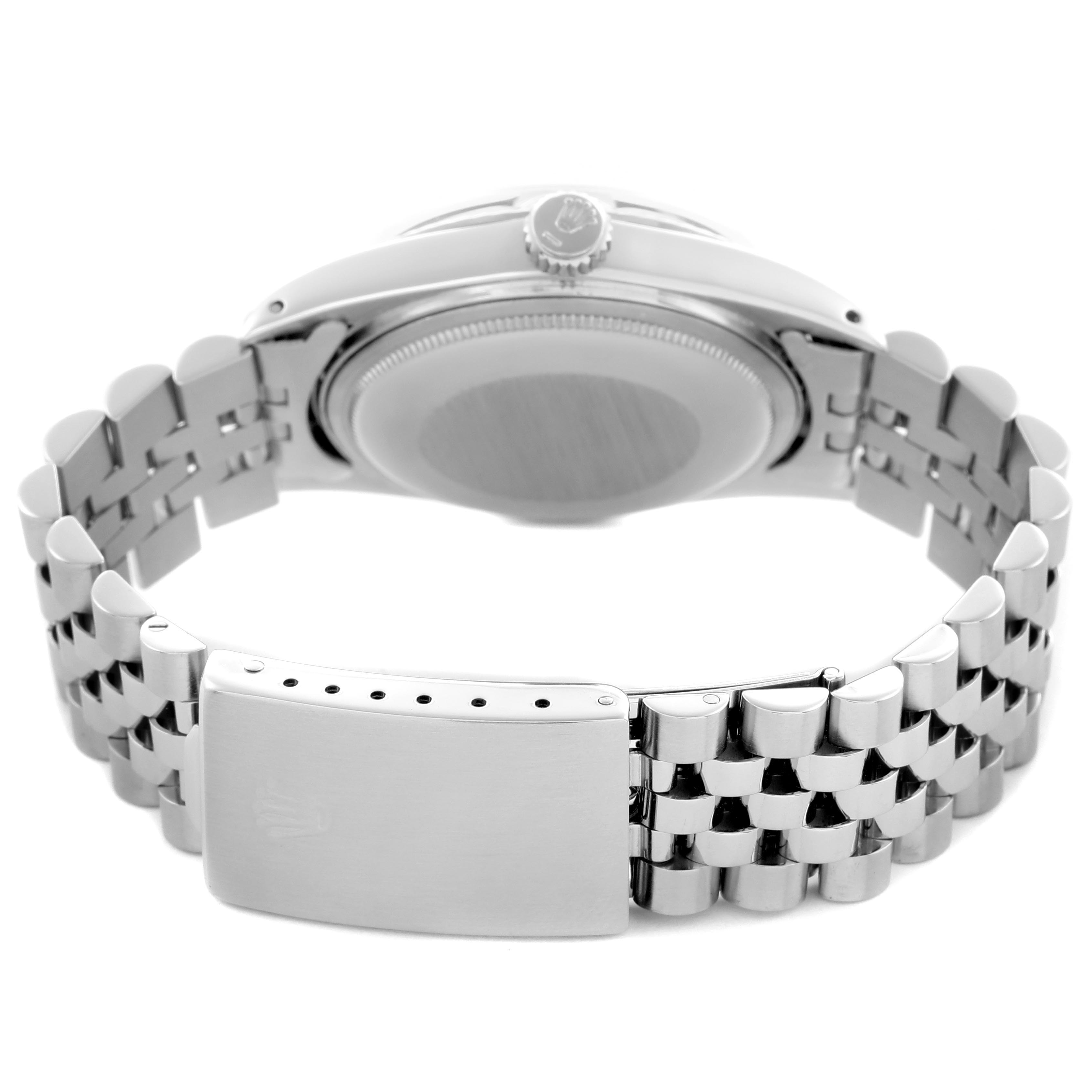 The image shows the back view of a Rolex Datejust 16014 Men's Stainless Steel Silver Dial 16014 Men's Stainless Steel Silver Dial watch, focusing on the bracelet and clasp with a partial view of the case back and crown.